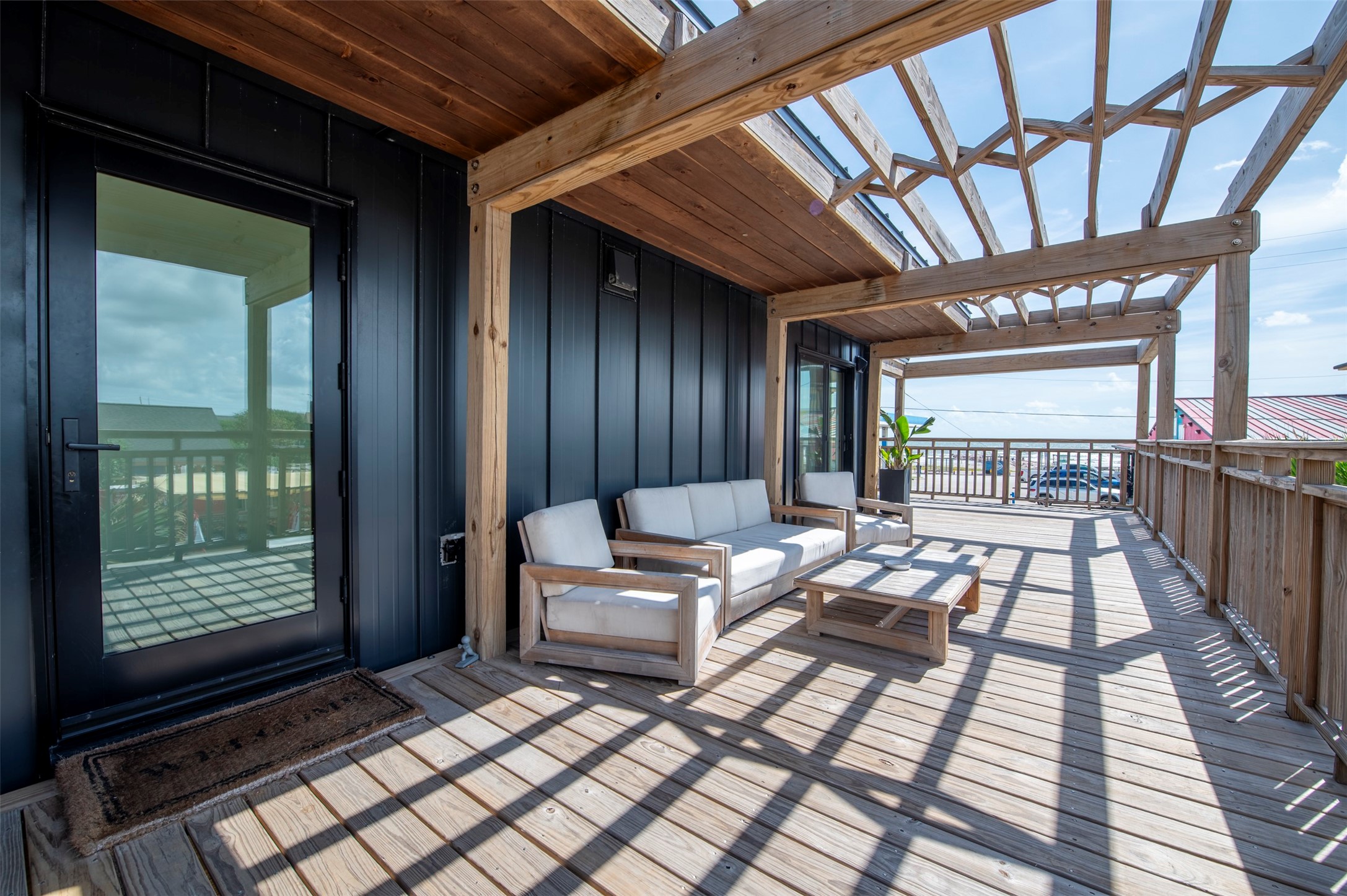 Front house 600+ sq ft deck with gulf views, pergola, and seating.
