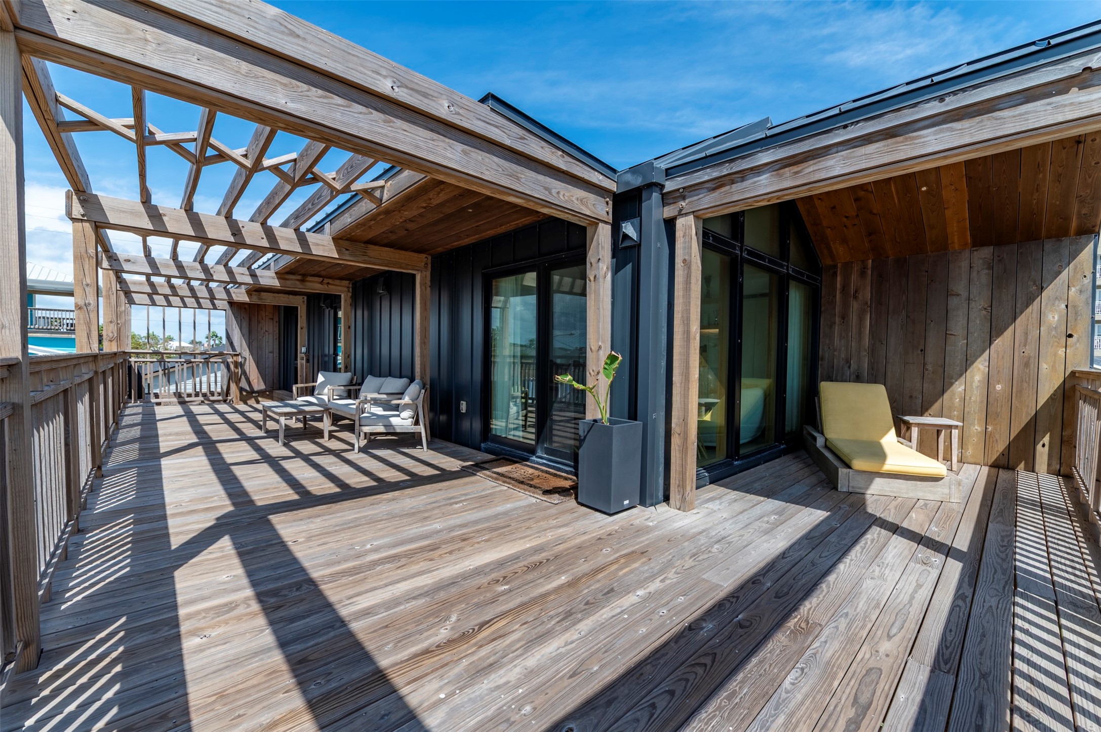 Back house 600+ sq ft deck with pergolas and shaded seating