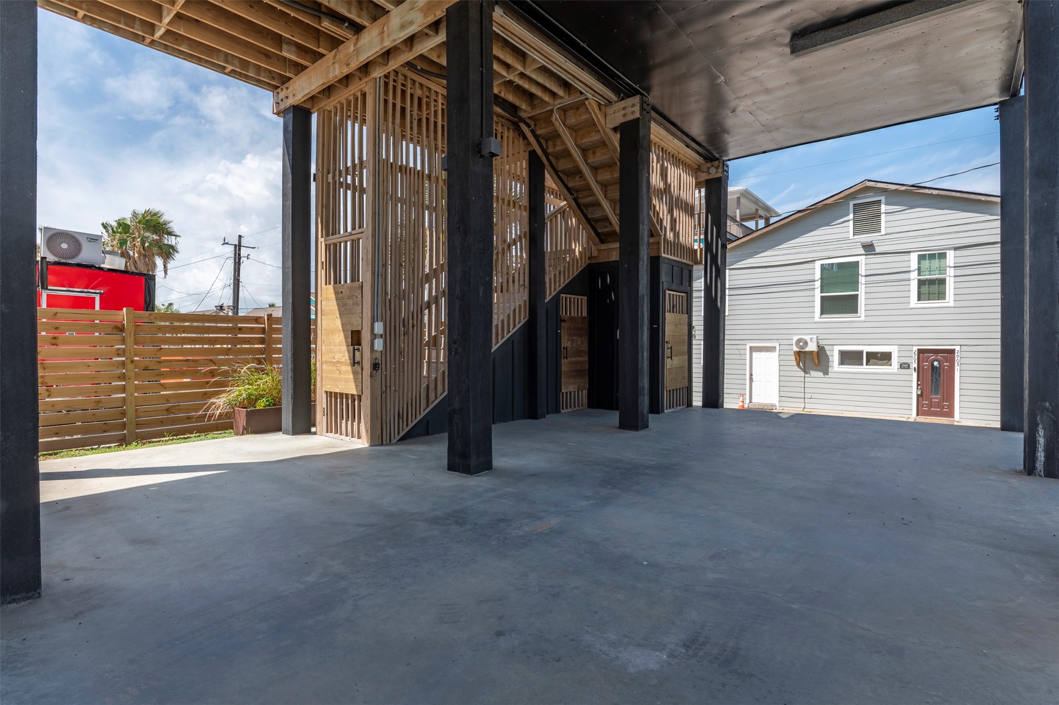 Back house private entry, outdoor shower, and storage