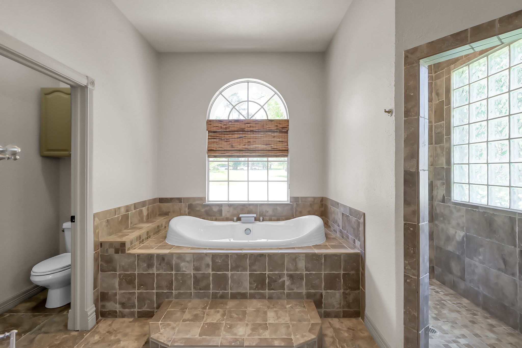 Primary Bathroom has Walk in Shower and Soaking Tub
