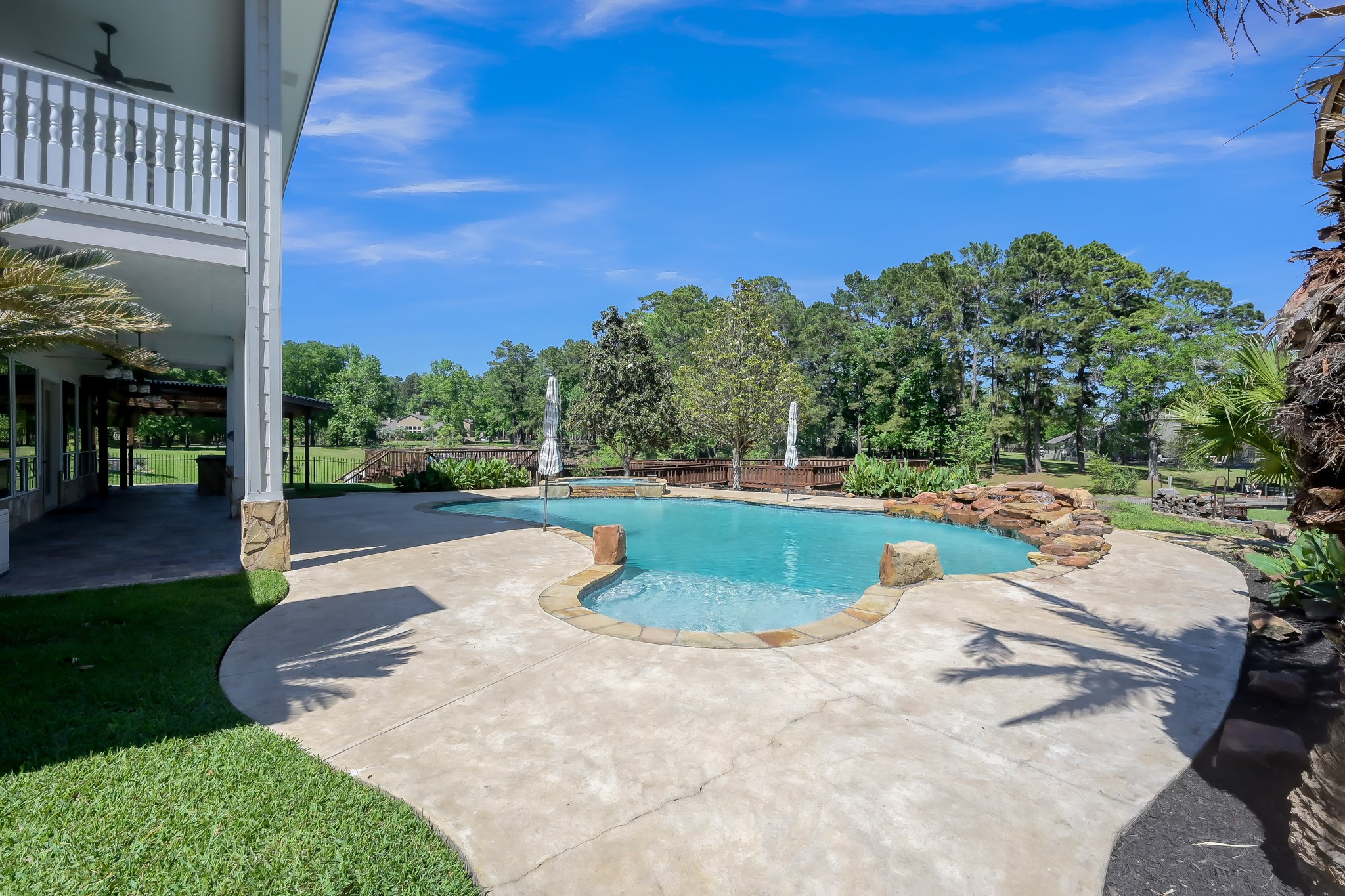 Pool has Hot Tub and Waterfall