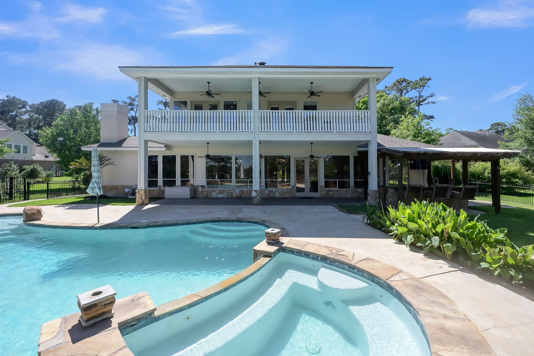 Grand Balcony across the back of house and covered patio downstairs