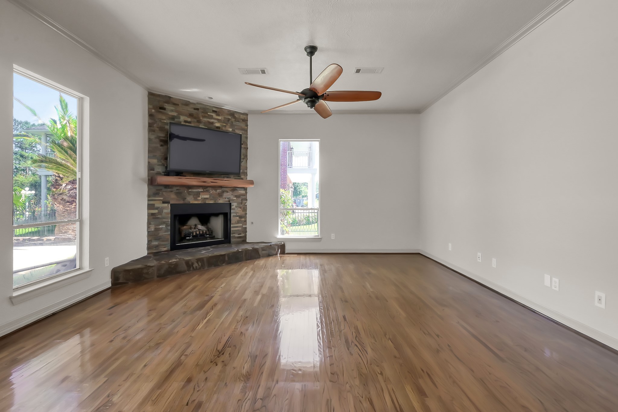Living Area has Beautiful Hardwood Flooring and Gas Log Fireplace