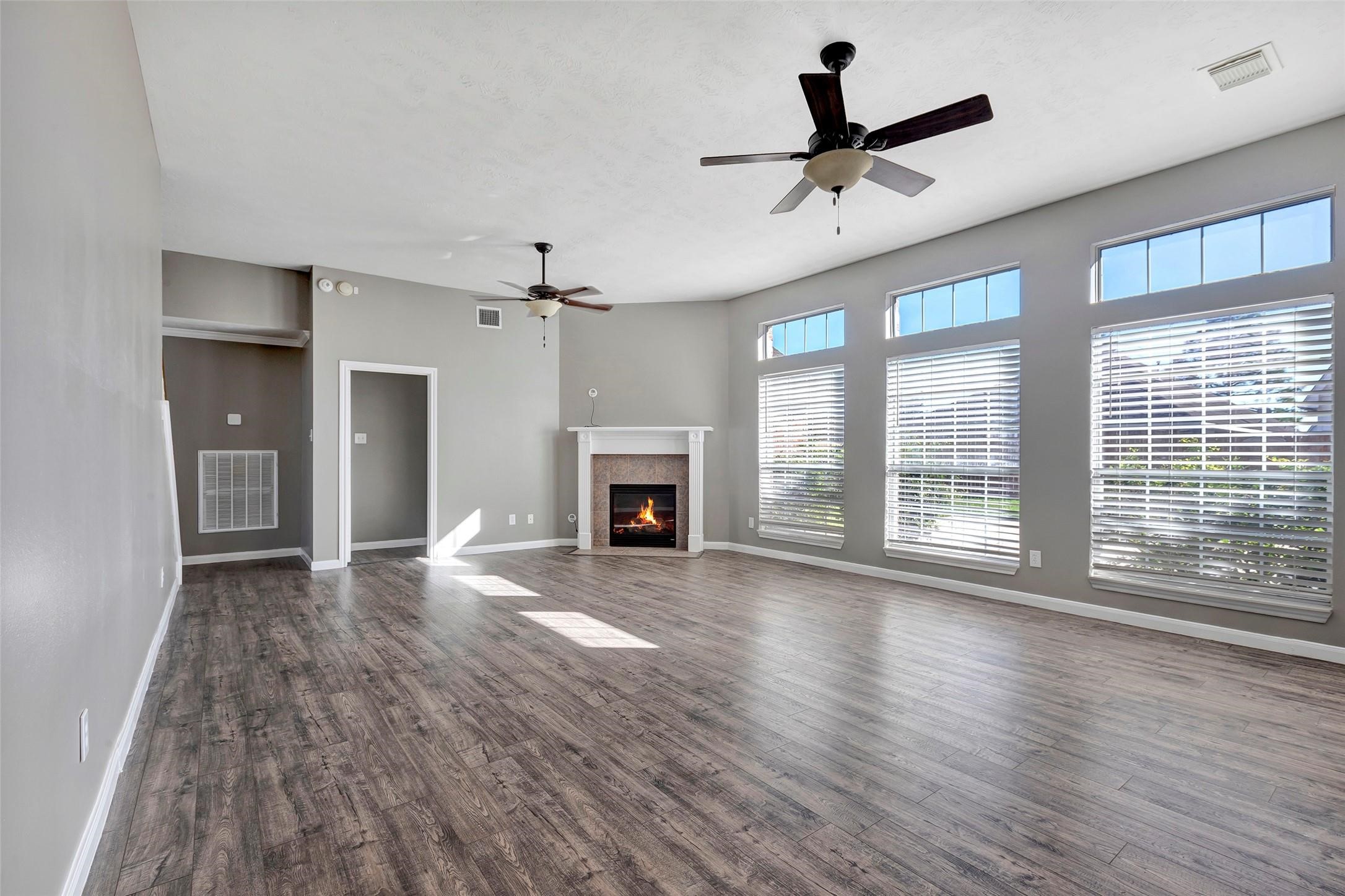 Spacious living room with views of the backyard.