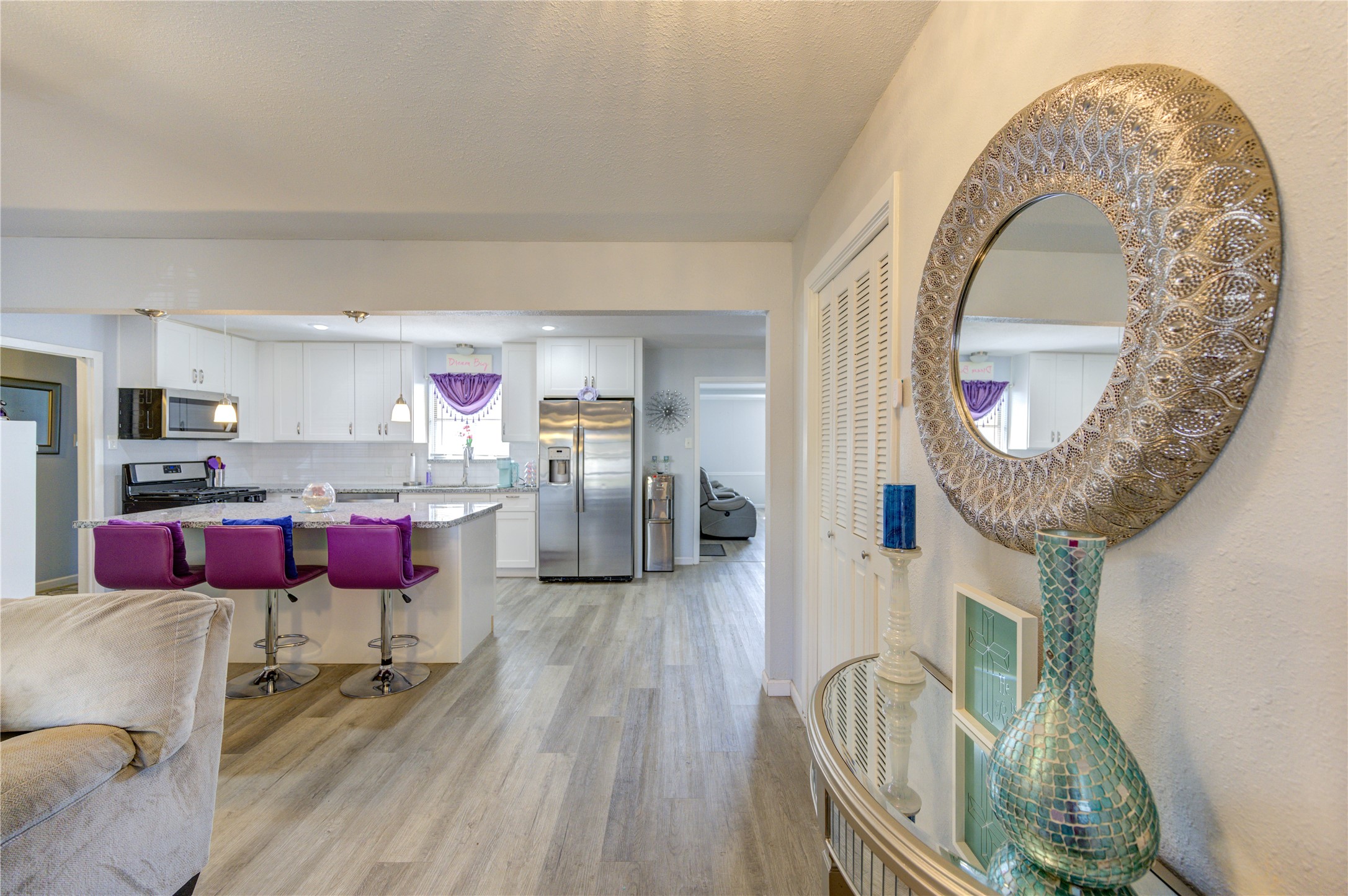 Just off the entryway you are greeted by a living room, kitchen, dining and den.