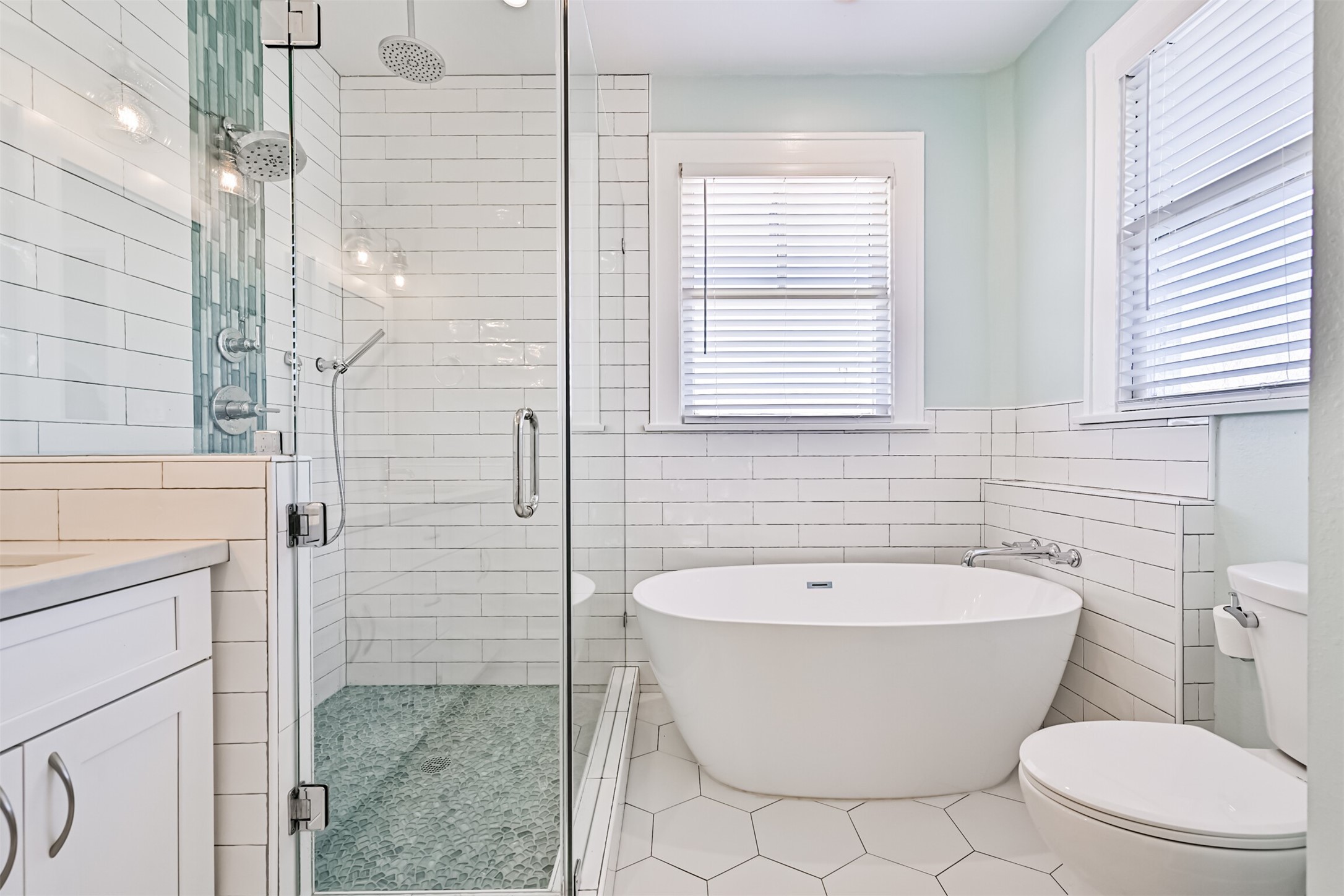 Spa like primary bath with freestanding soaker tub,