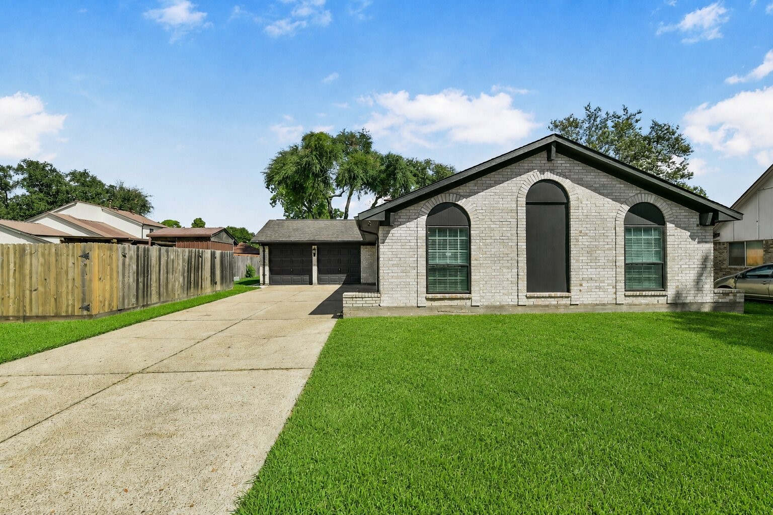 Charming single-story home with a spacious driveway, classic brick exterior, and well-maintained lawn, offering ample space and great curb appeal. Charming single-story home with a spacious driveway, classic brick exterior, and well-maintained lawn, offering ample space and great curb appeal.