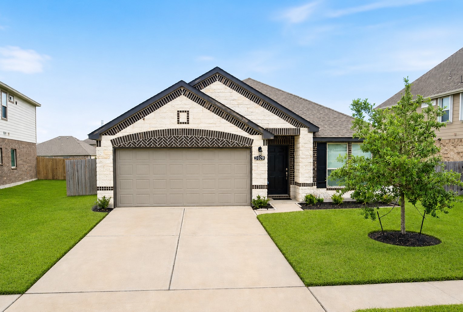 Charming single-story home with a modern brick exterior, featuring a spacious two-car garage and a well-manicured front lawn. Charming single-story home with a modern brick exterior, featuring a spacious two-car garage and a well-manicured front lawn.