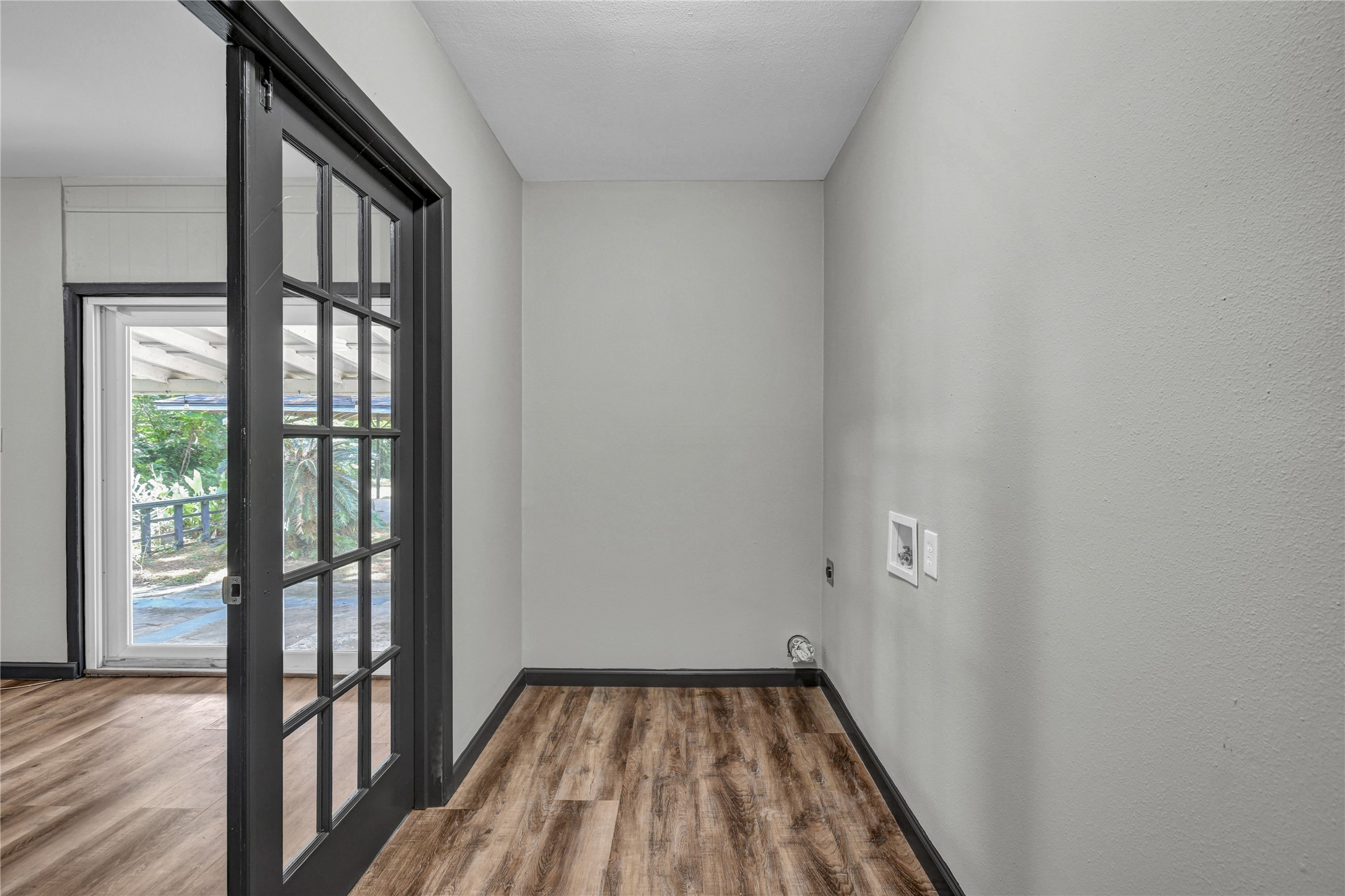 Utility room with electric washer and dryer connections