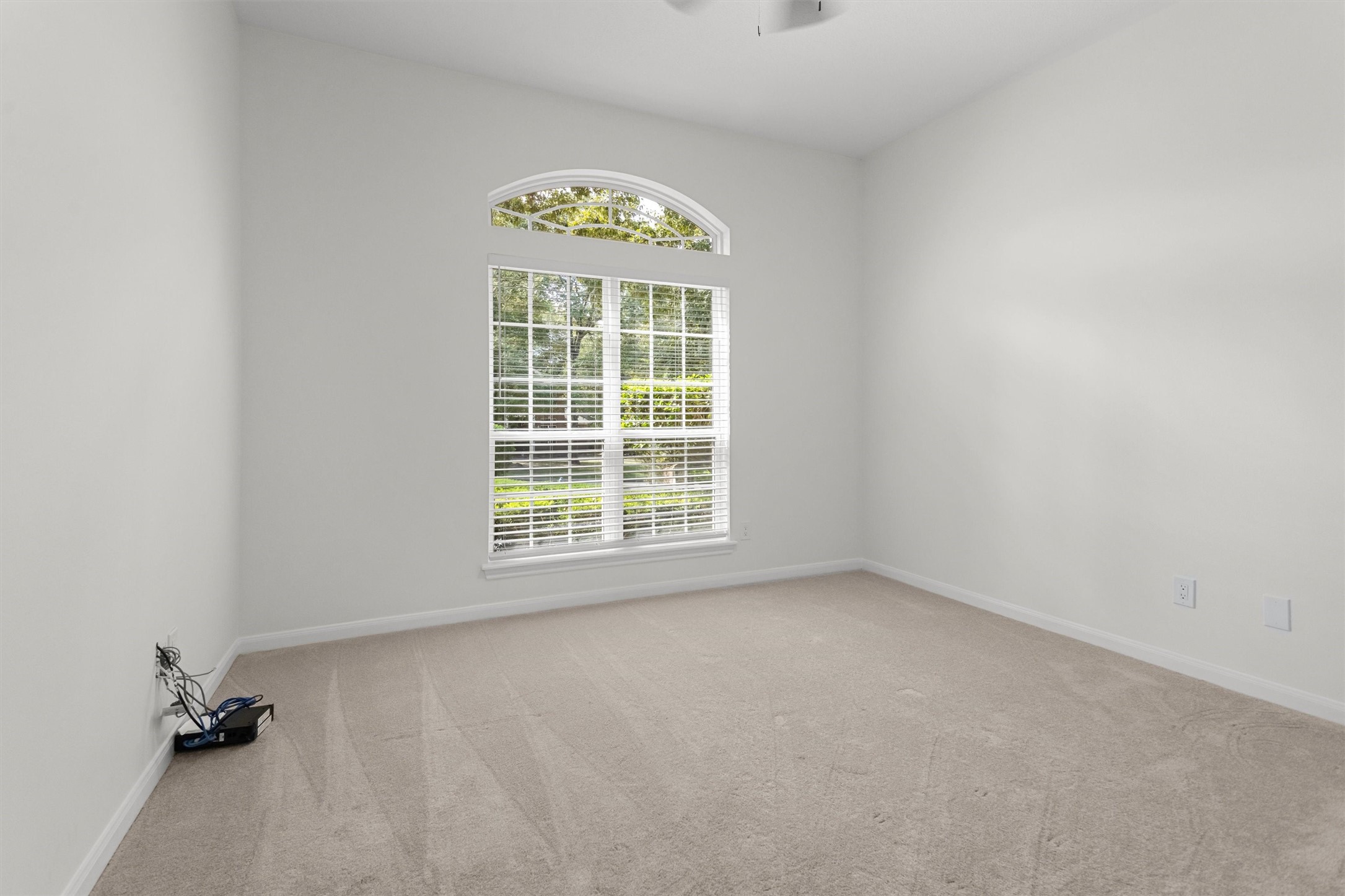 This home features a desirable split floor plan. The primary bedroom and a flexible roomperfect for use as a study or a fourth bedroomare situated on one side of the house, while two additional bedrooms and a full bathroom are located on the opposite side for added privacy.