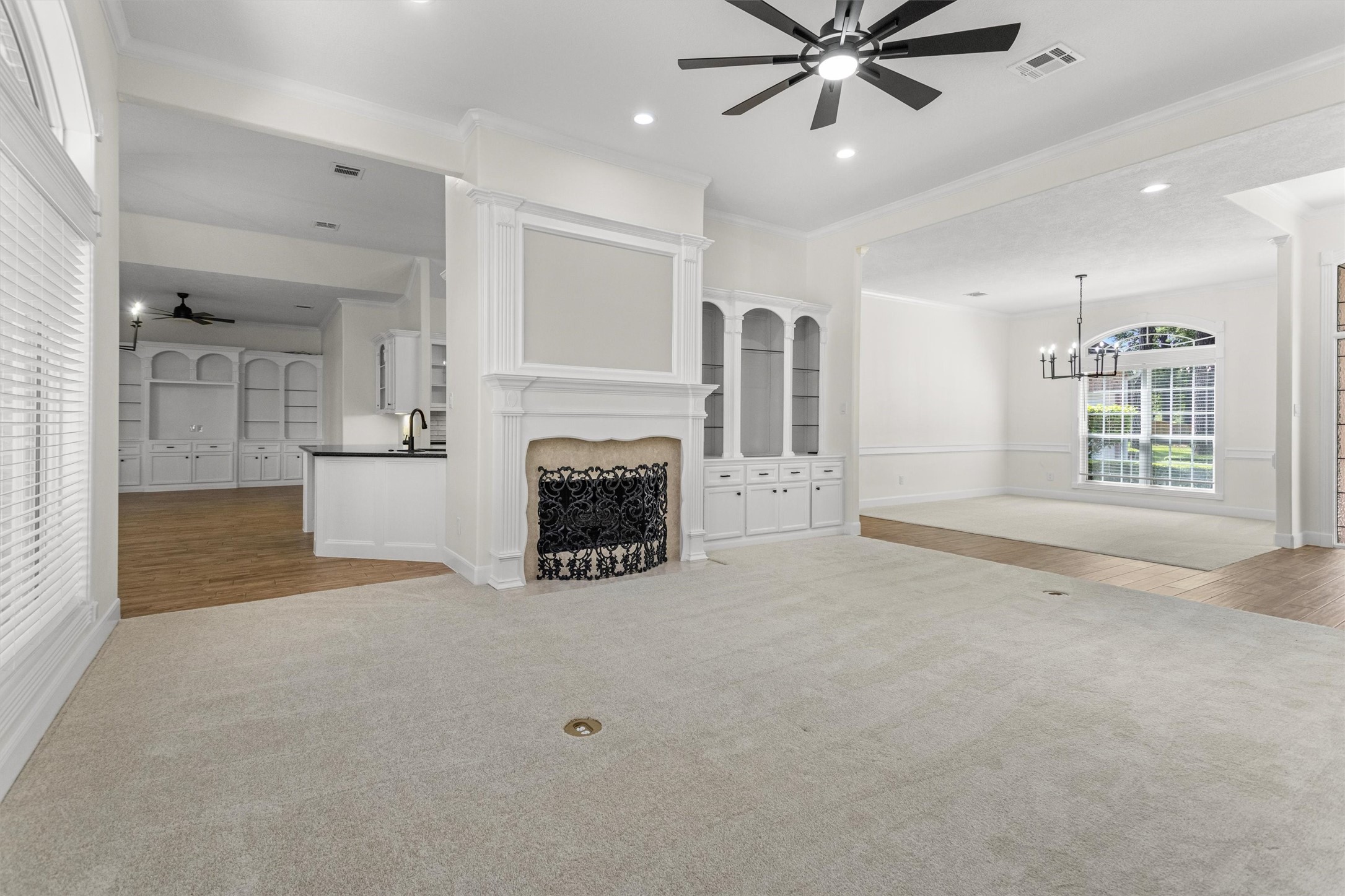 The seamless flow of this floorplan is perfect for hosting large gatherings. Upon entry, you are greeted by the formal dining and living areas, which feature a convenient pass-through leading directly into the breakfast room, den, and kitchen.