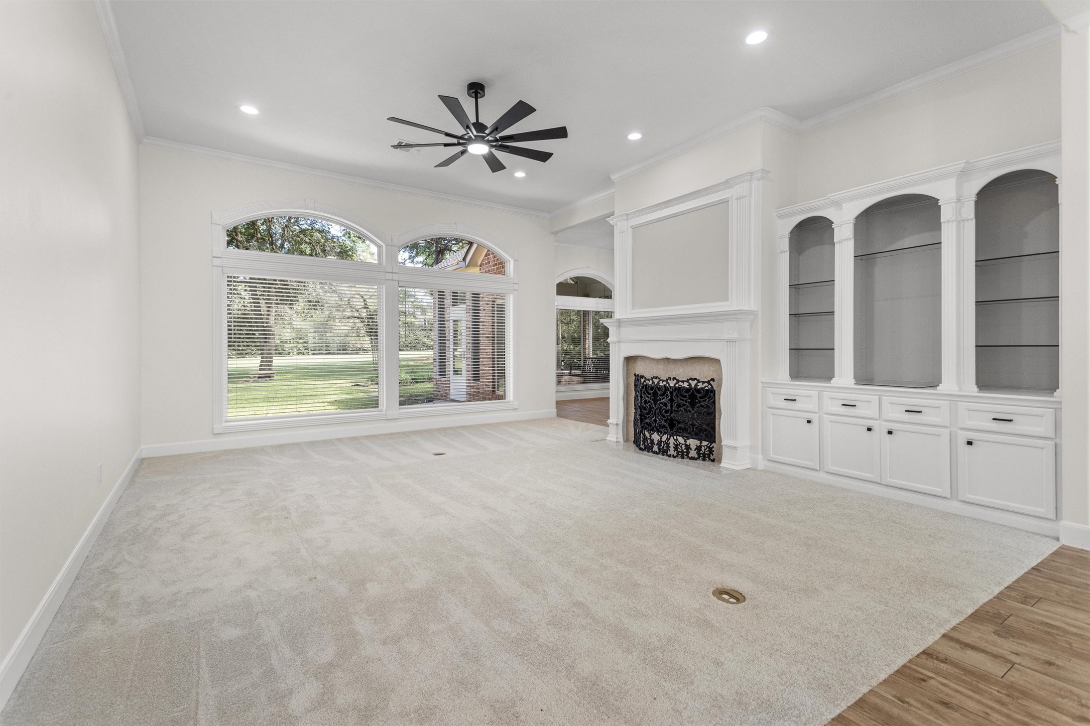 Spacious living room with fireplace, built-ins and backyard views. The seller has updated the home with paint throughout, flooring and fixtures. Spacious living room with fireplace, built-ins and backyard views. The seller has updated the home with paint throughout, flooring and fixtures.