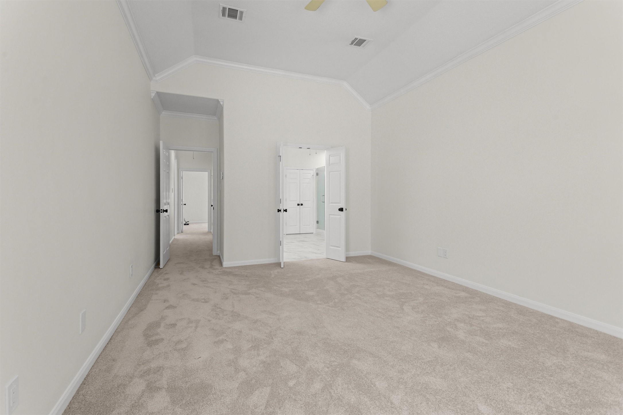 Primary bedroom featuring an ensuite bathroom.