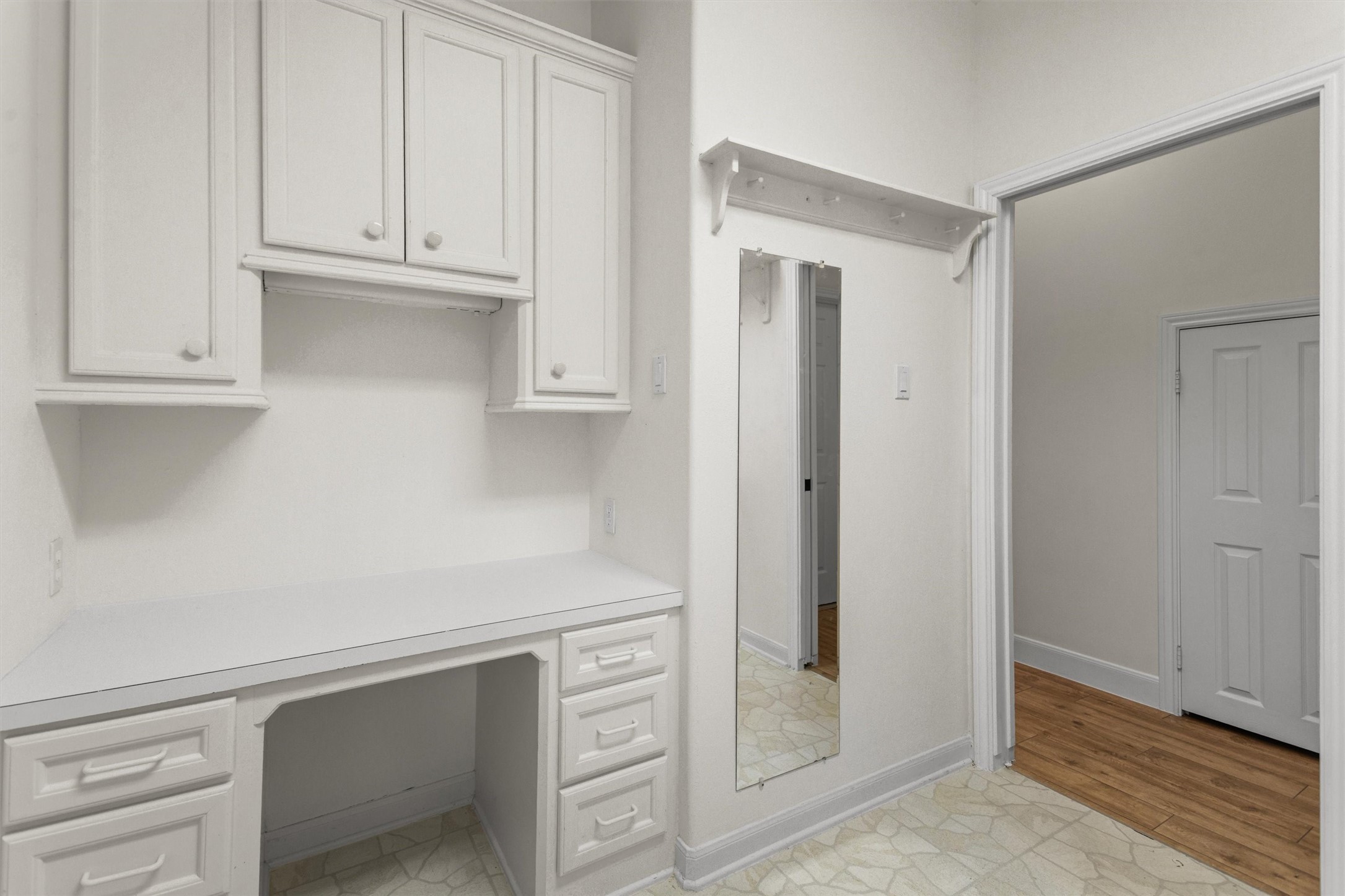 You'll love the huge laundry room with tons of space for folding, plus there's a handy built-in desk that's perfect for tackling projects or getting some paperwork done.