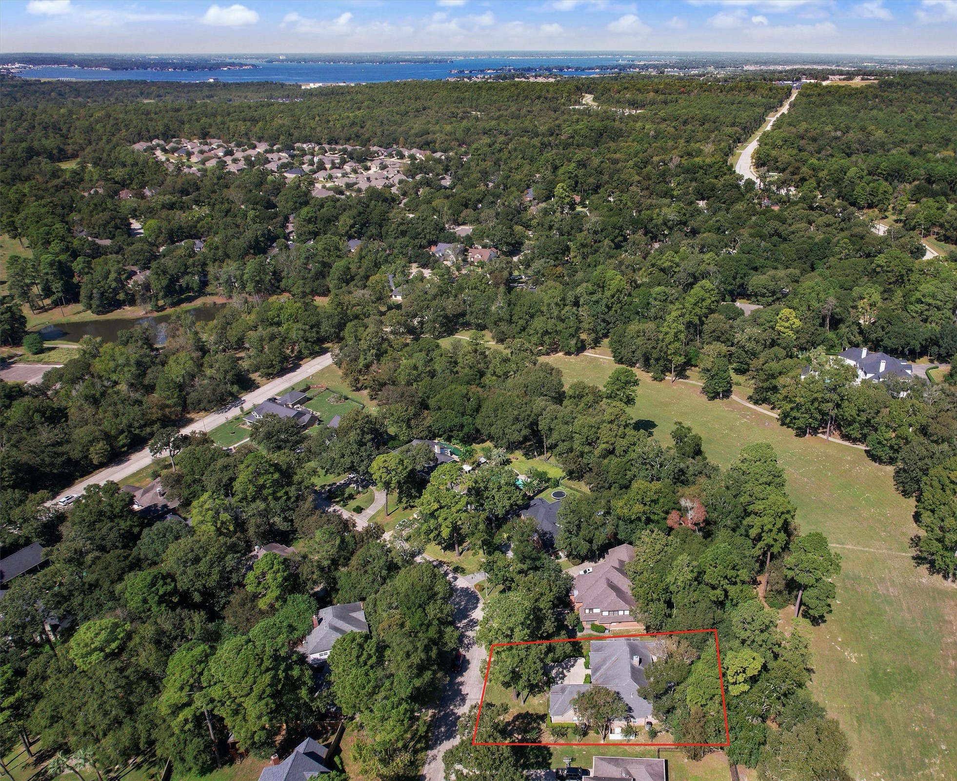 Aerial view shows the home and its proximity to the adjoining greenspace (former Wedgewood Golf Course now owned by City of Conroe) and to Lake Conroe. Aerial view shows the home and its proximity to the adjoining greenspace (former Wedgewood Golf Course now owned by City of Conroe) and to Lake Conroe.