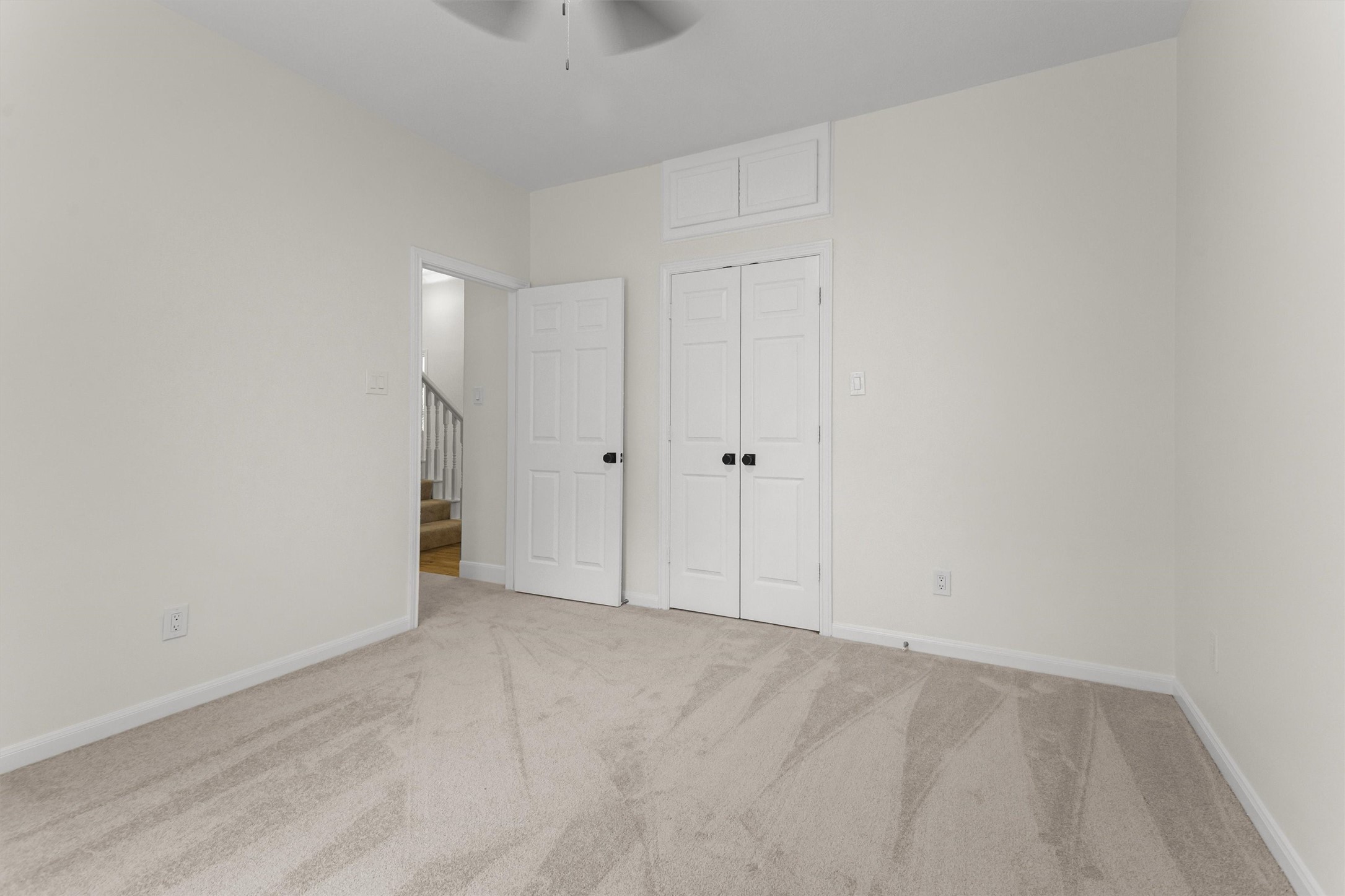 This secondary bedroom features a Hollywood bath and is conveniently located near the gameroom on the 1.5-story level.