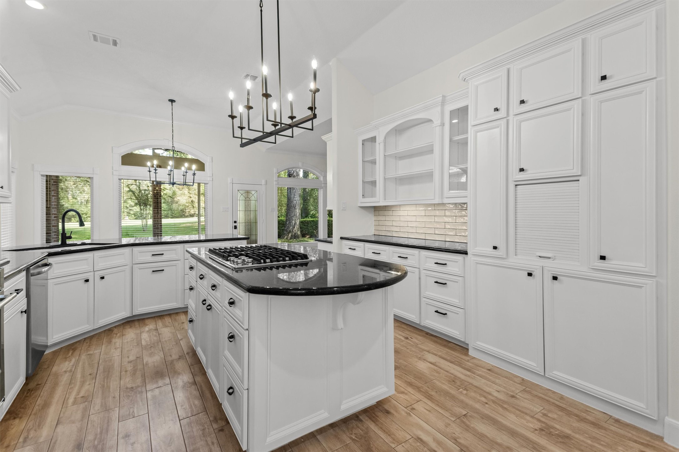 The updated kitchen features new fixtures, flooring, paint, and a new oven and stove. It offers ample storage space for all your cookware and provides a lovely view of the backyard to enjoy while you cook. The updated kitchen features new fixtures, flooring, paint, and a new oven and stove. It offers ample storage space for all your cookware and provides a lovely view of the backyard to enjoy while you cook.