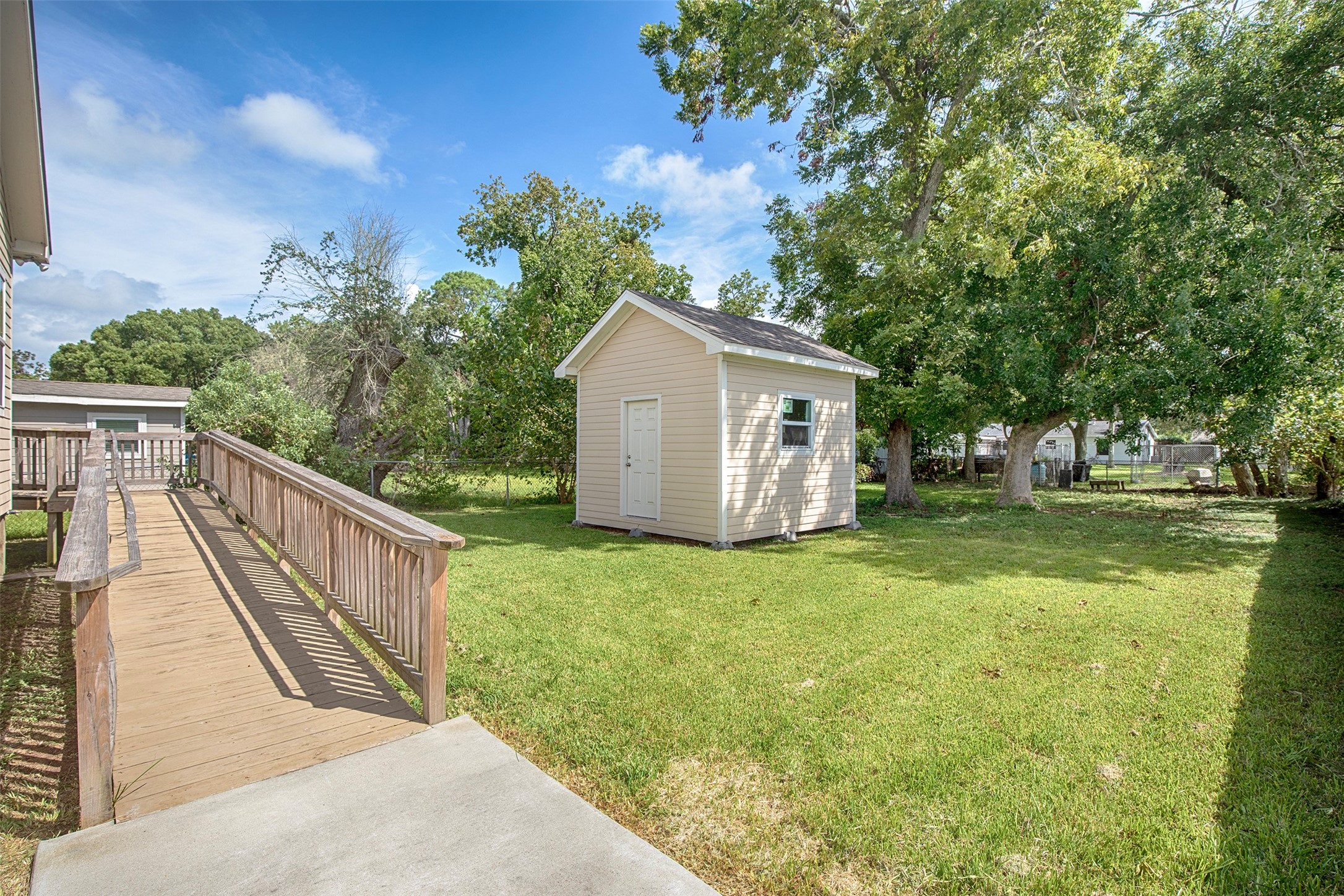 View of the ramp at the back of the home and backyard.