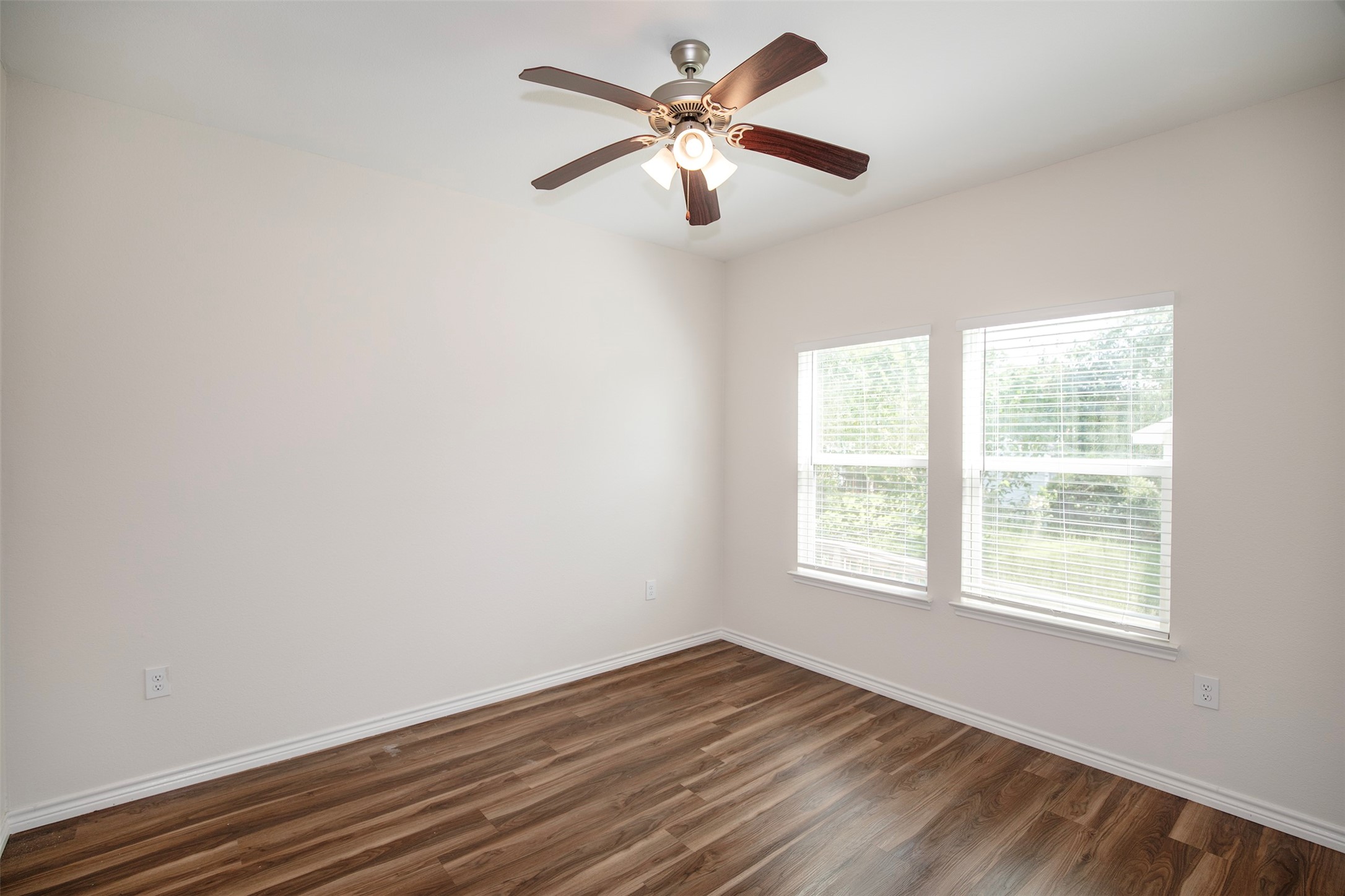 The primary bedroom has enough space for king size furniture.