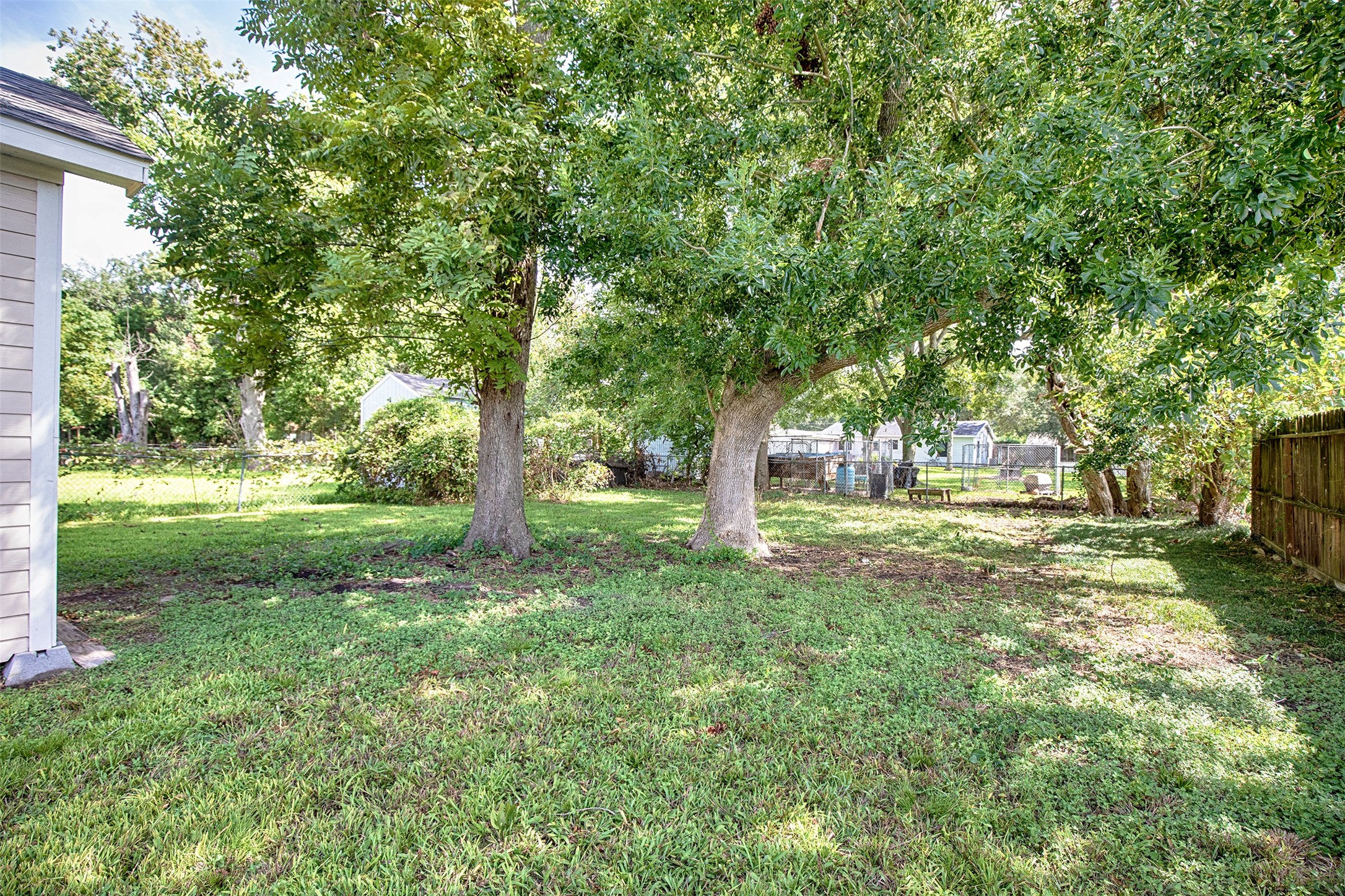 The mature trees in the backyard provide marvelous shade on a hot summer day.