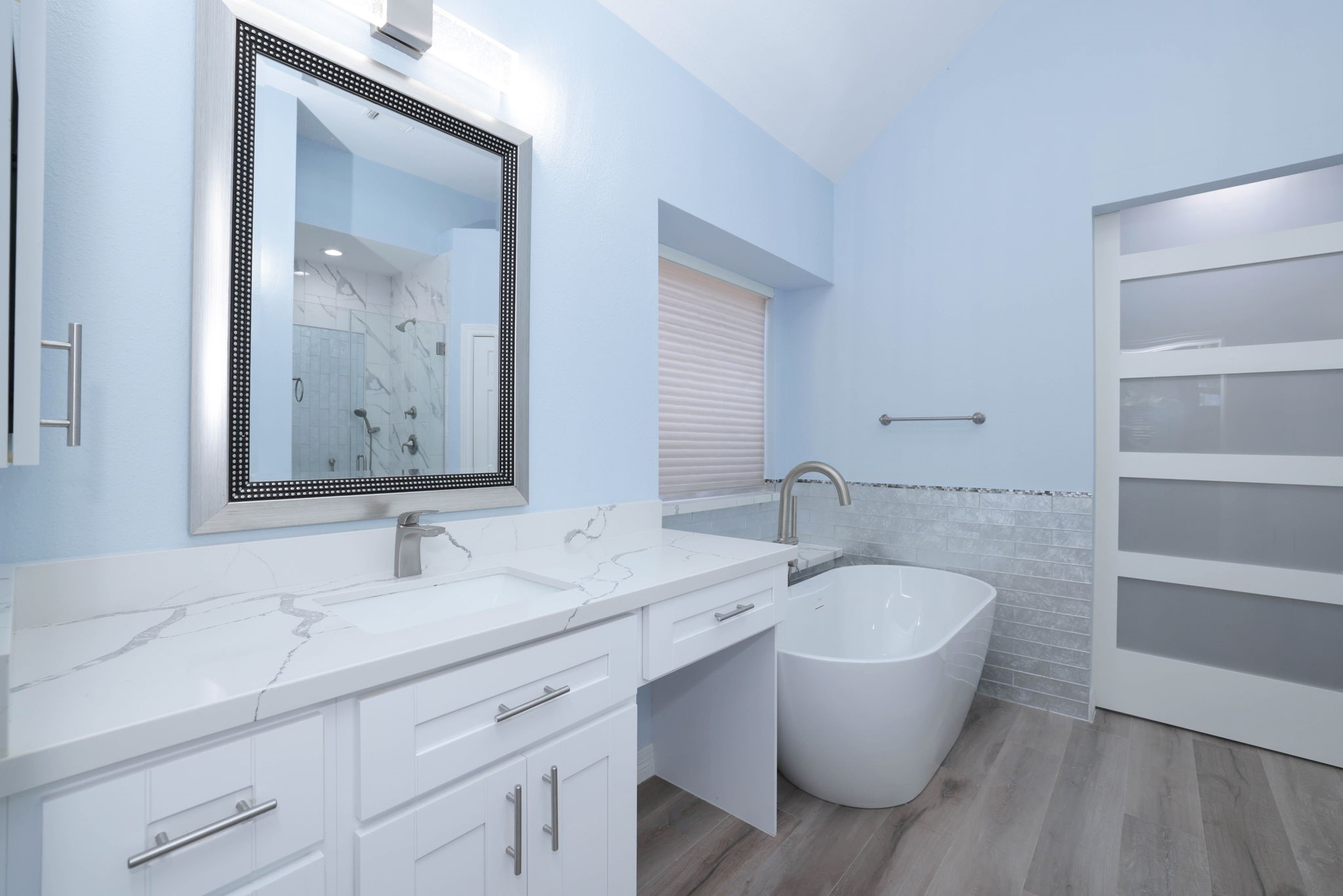 Another view of the bath.  The sliding glass door lrads to one of the 2 primary closets.
