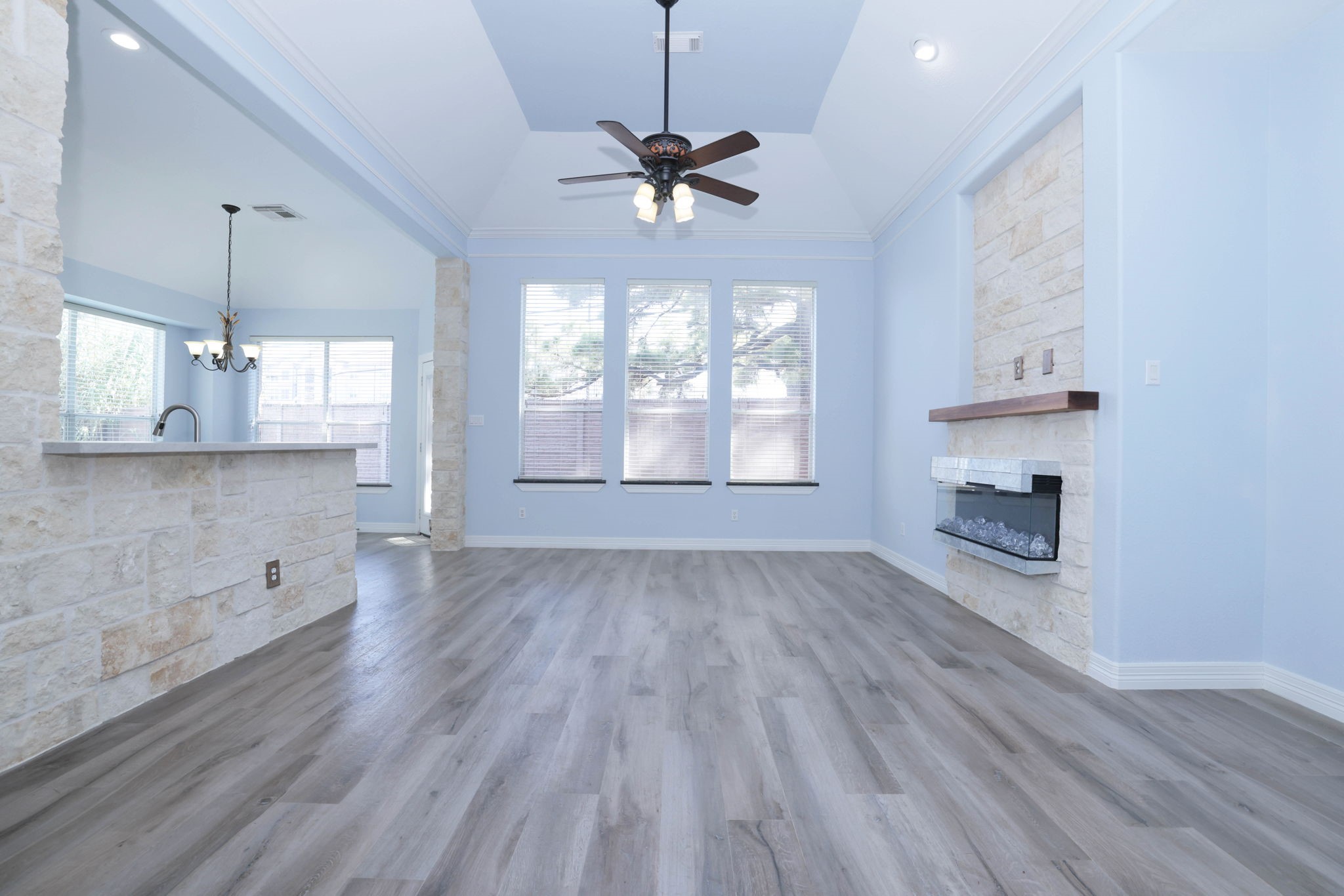 This open plans has wood looking tile flooring throughout the entire first floor.