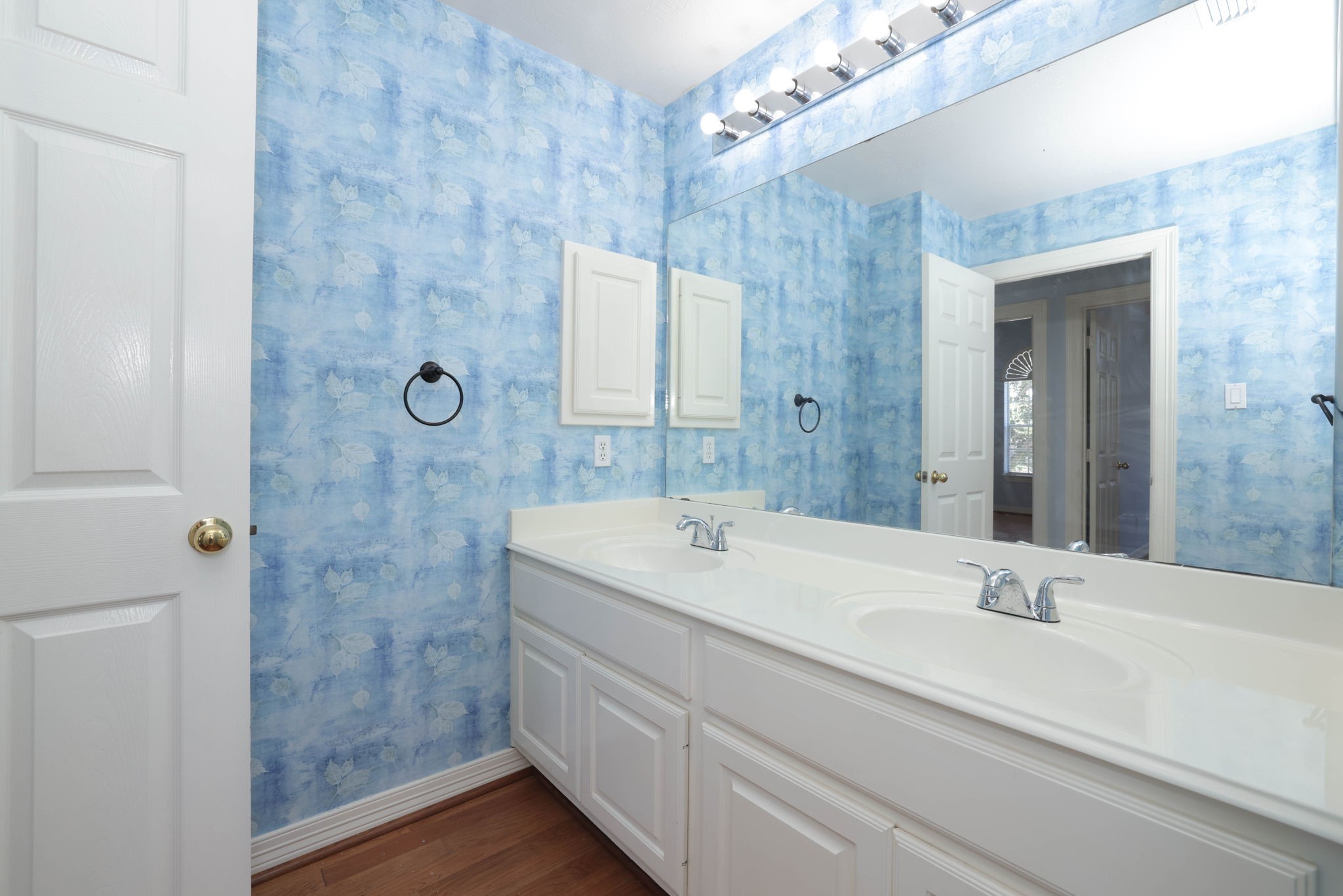 Bathroom is shared with bedroom 2 and 3 and has double sinks.