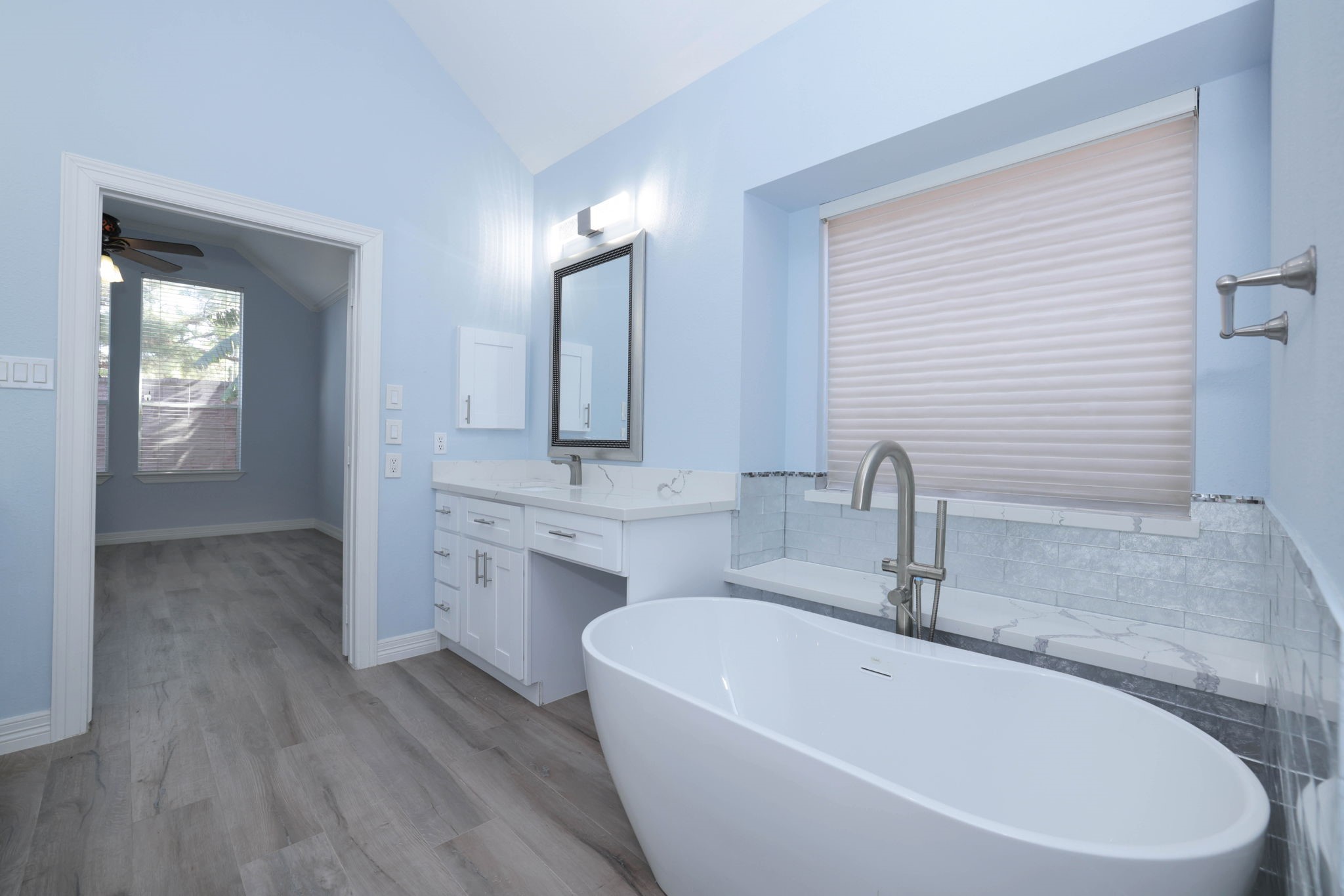 No expense was spaired on this bathroom.  There is even a vanity and quartz window sill.