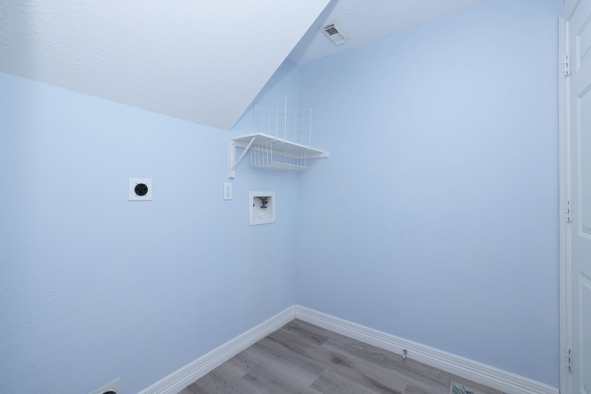 The laundry room is on the first floor.  There are hook ups for gas and electric.