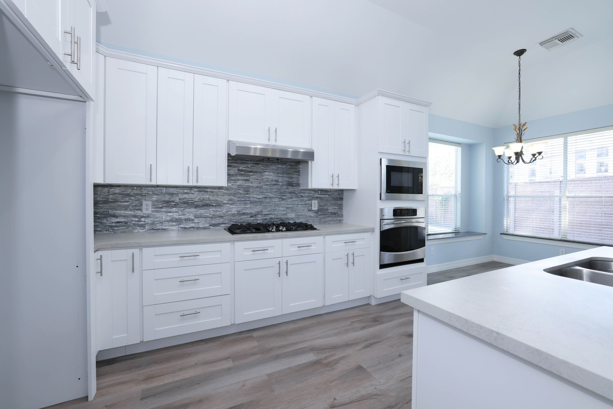 Thia spacious kitchen has all new soft close cabinets.