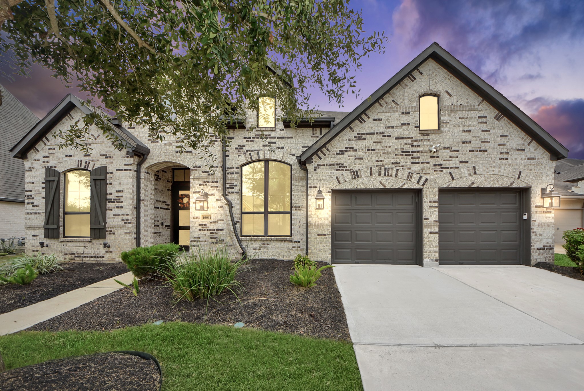 Beautiful brick and stone exterior with inviting curb appeal and an attached two-car garage. Beautiful brick and stone exterior with inviting curb appeal and an attached two-car garage.
