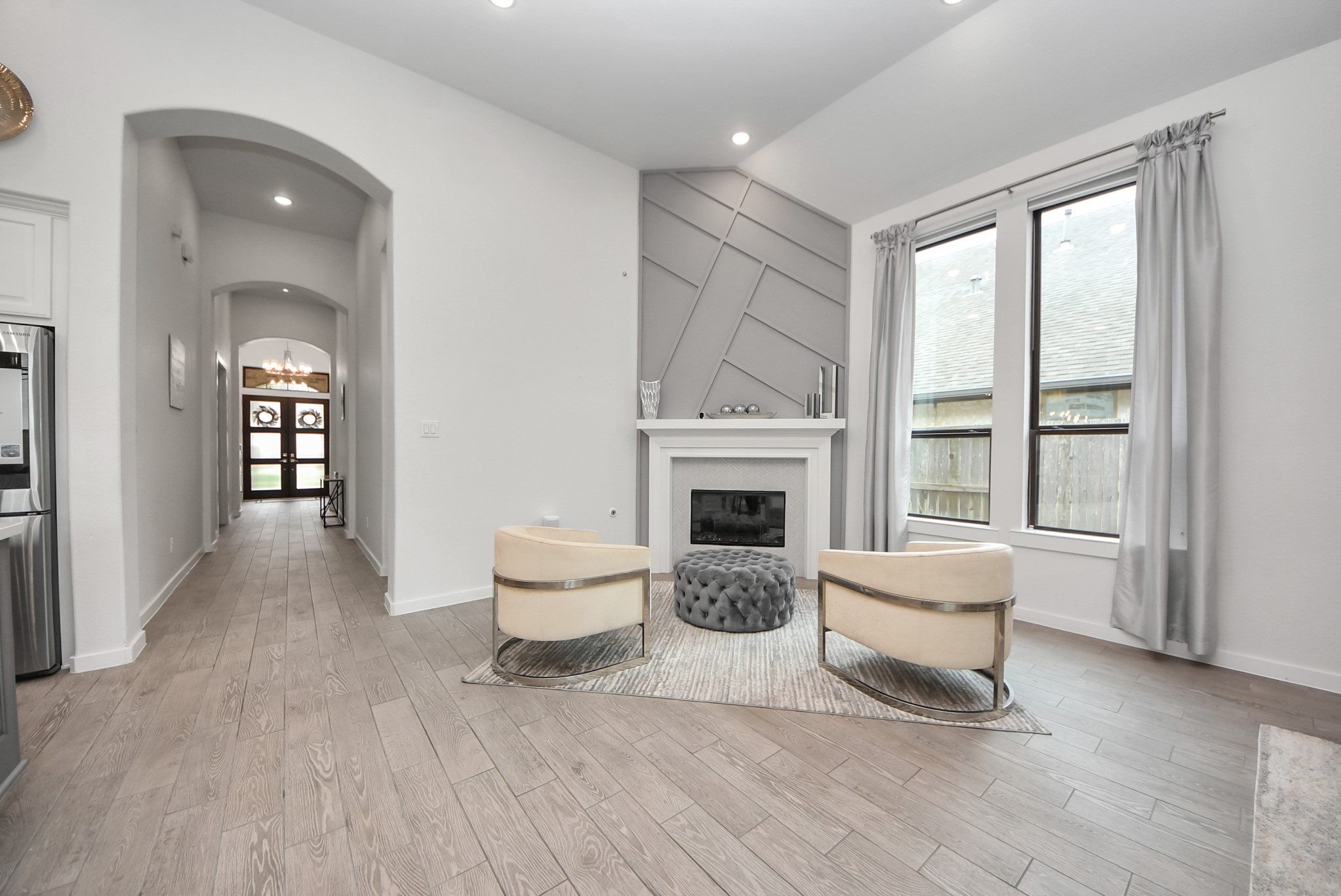 Bright and inviting entryway with neutral finishes and abundant natural light.