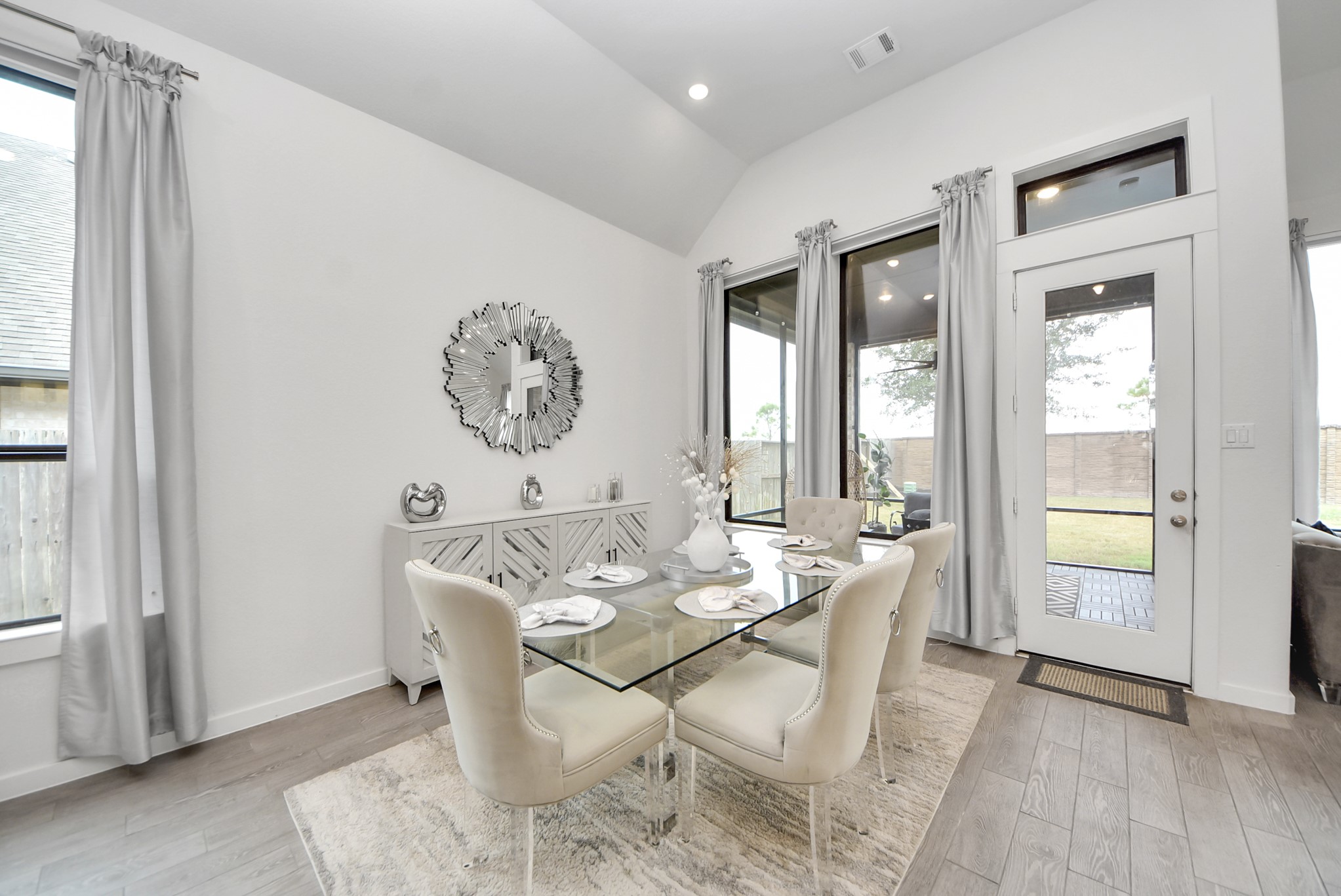 Bright dining area with large windows and an inviting atmosphere.