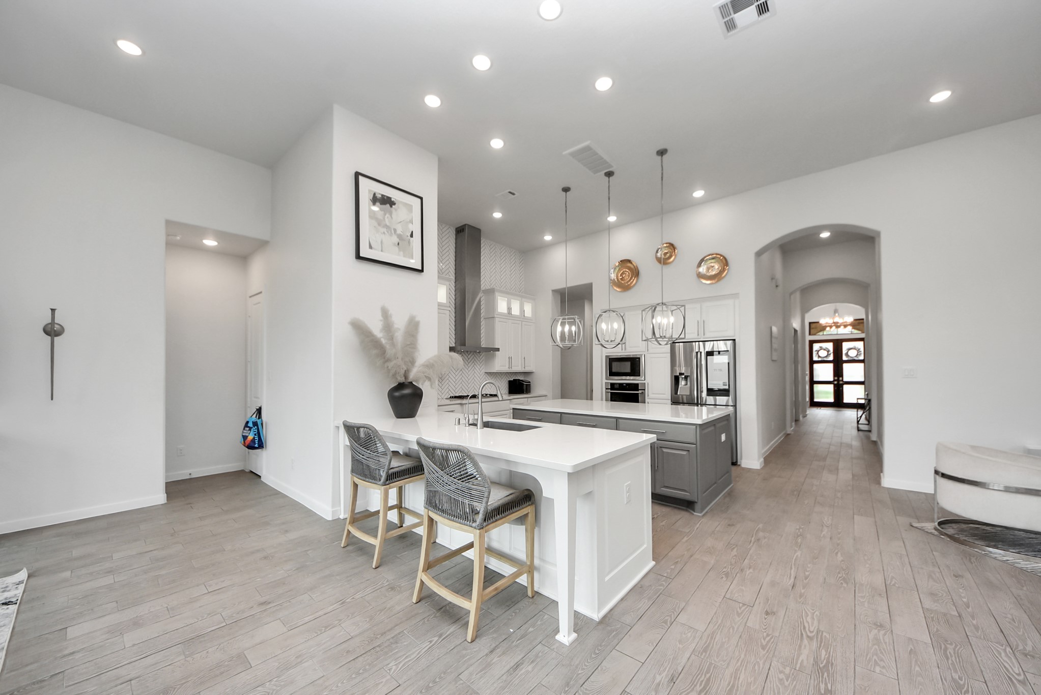 Bright dining and kitchen area featuring an open layout and contemporary finishes.