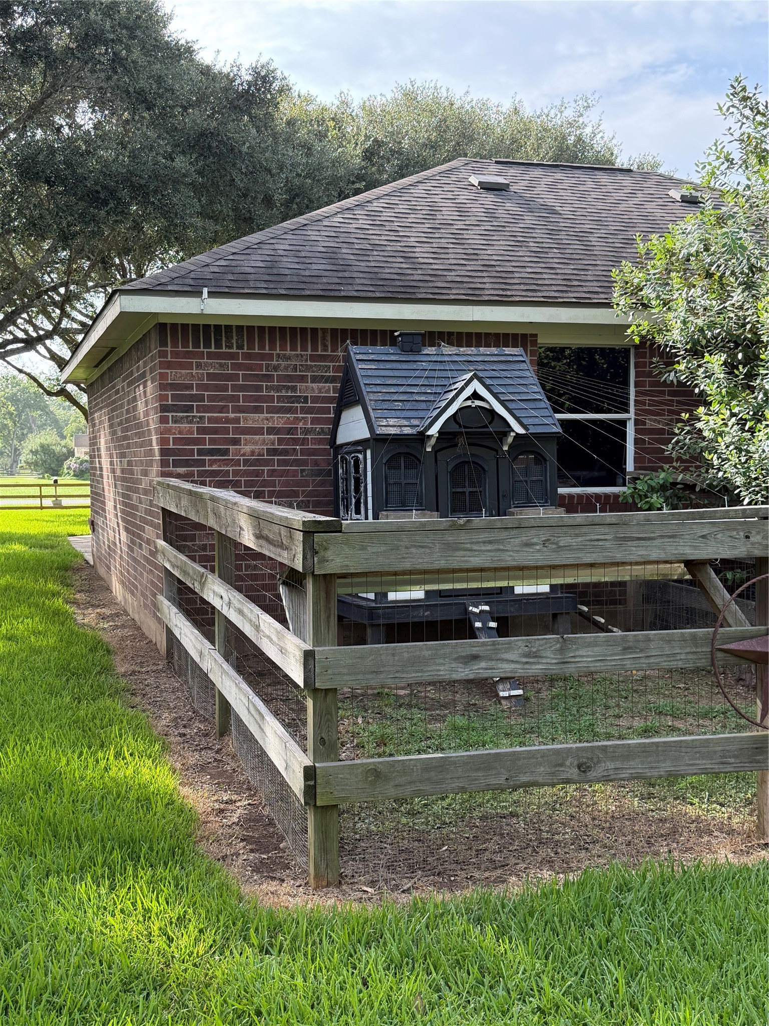 Chicken coop includes top cover protection