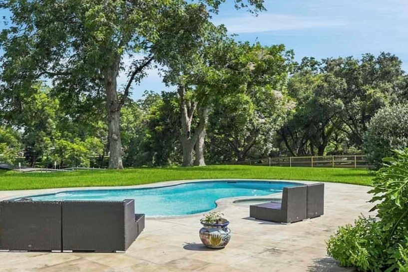 Relax in this large, heated pool and hot tub with tons of room for entertaining