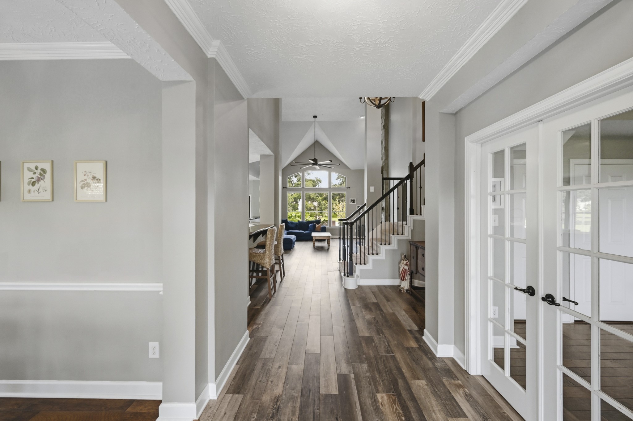 Elegant entry showcasing the formal dining room, study, and exquisite architectural details.