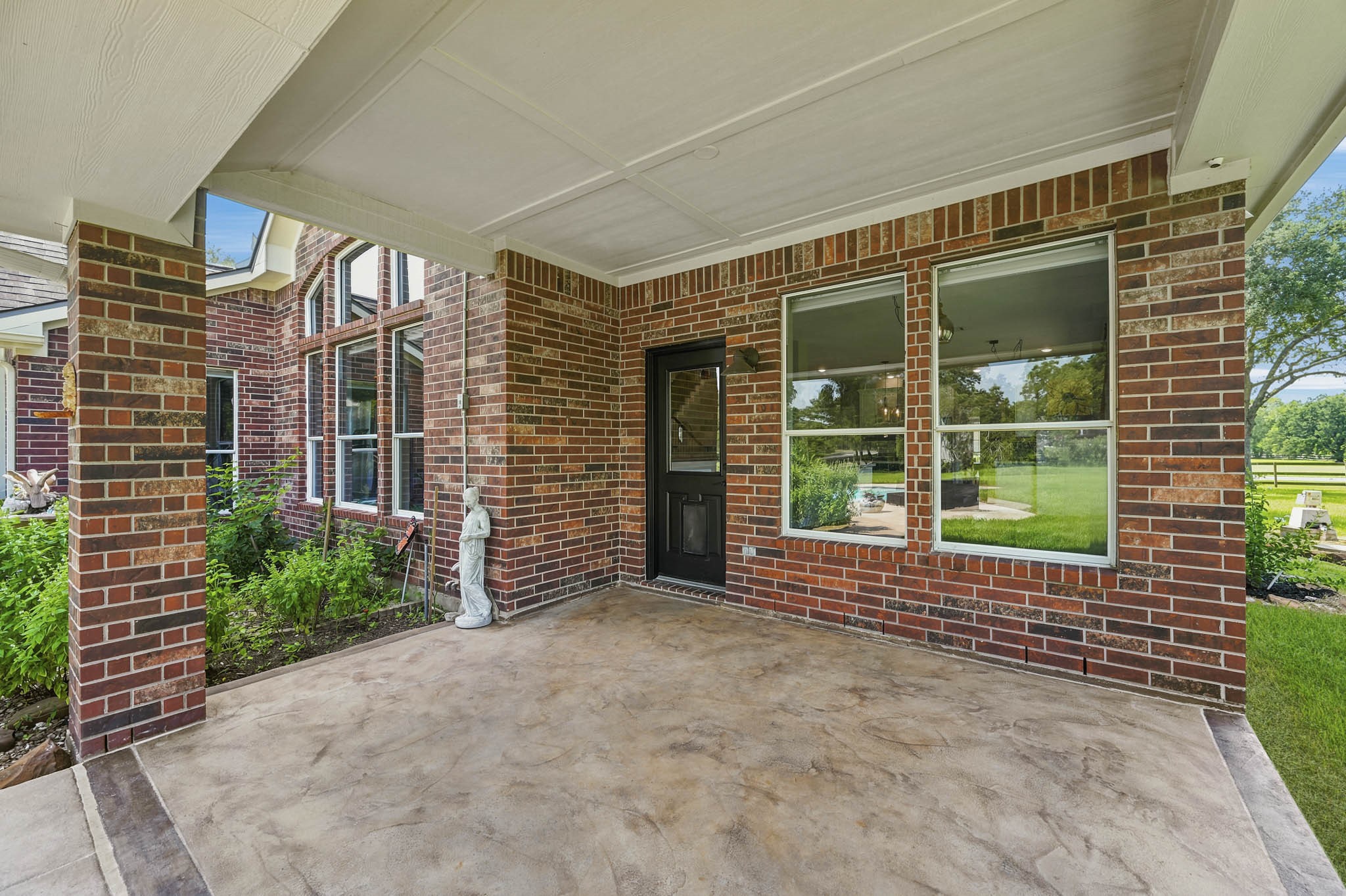 Spacious covered patio, perfect for outdoor entertaining and relaxation.