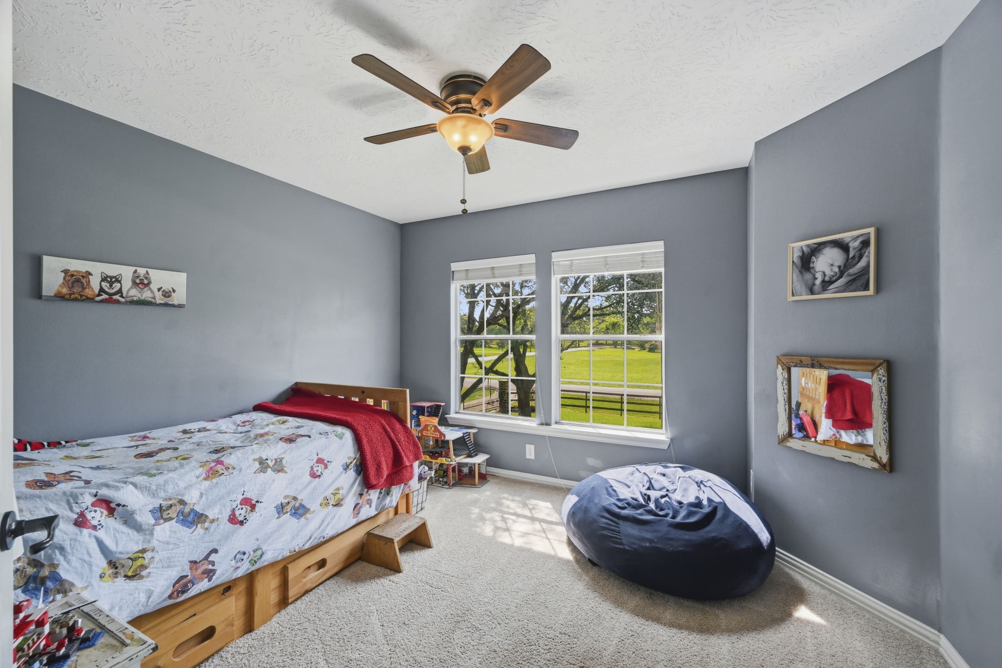 Secondary bedroom with beautiful treetop views.