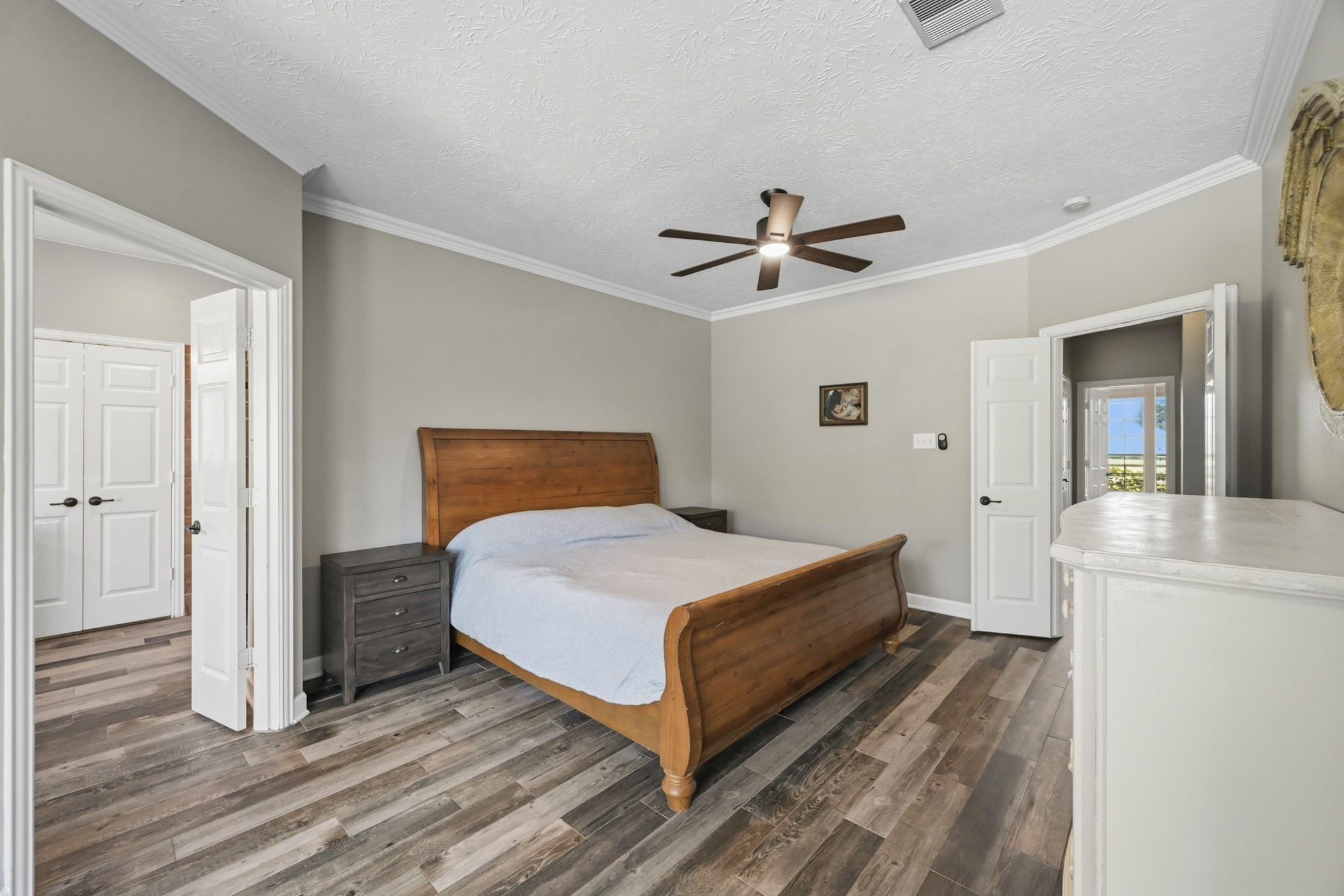 Spacious primary bath with elegant finishes and abundant natural light.