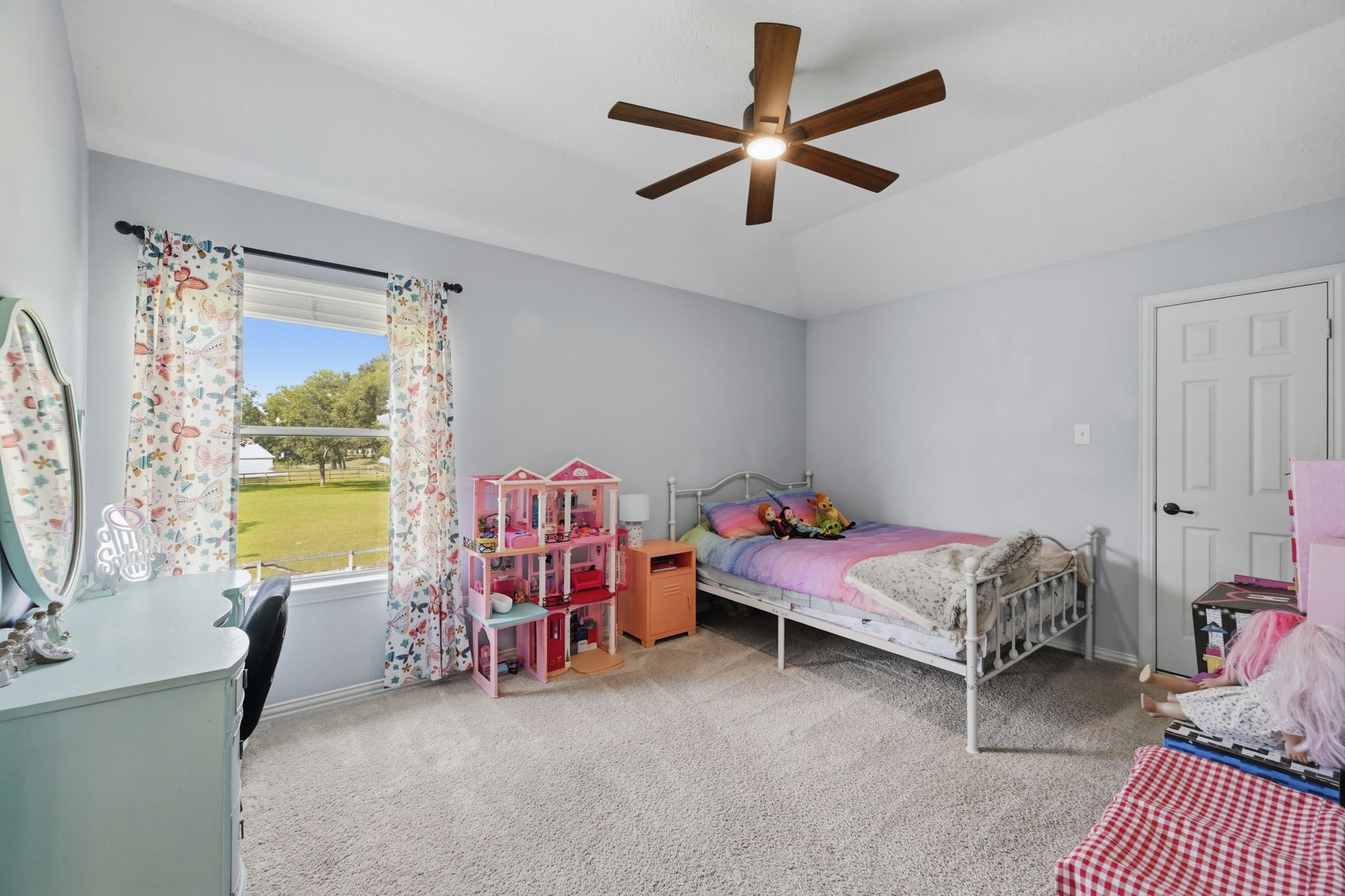 Additional secondary bedroom with peaceful treetop views.