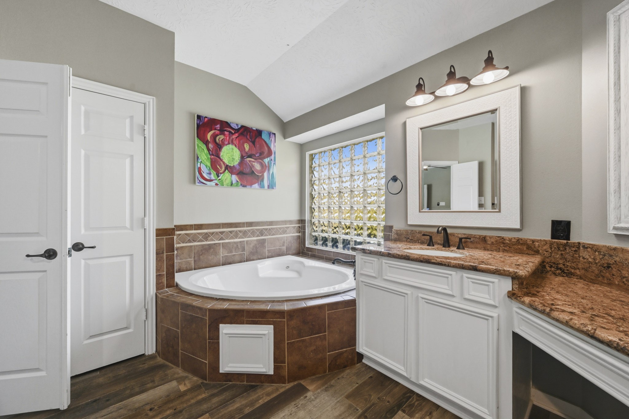 Relaxing soaking tub in the private primary bath.