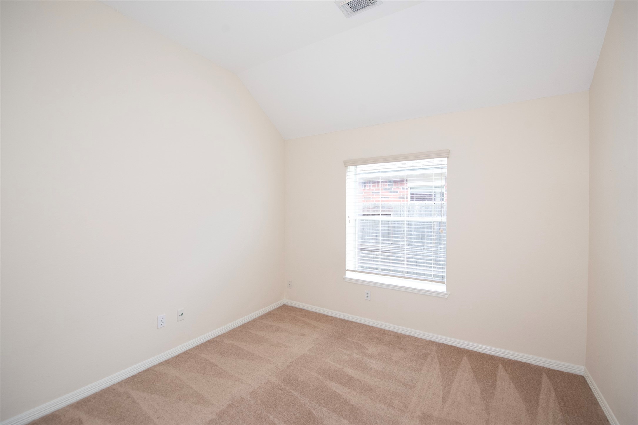 The third bedroom also provides great space and vaulted ceiling.