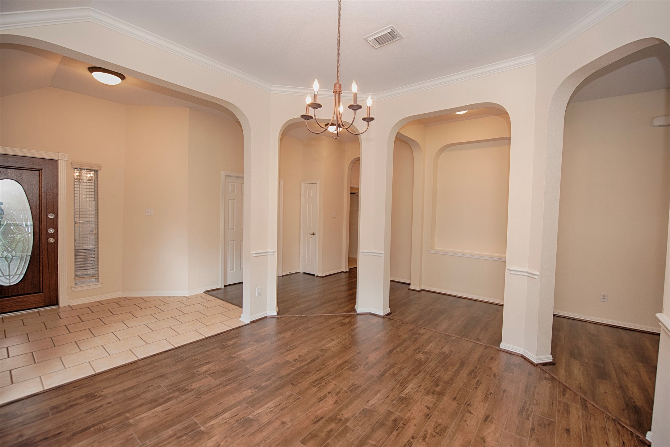A view of the formal dining room open to the foyer.