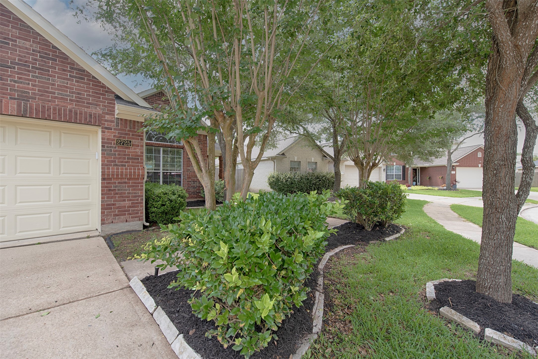 nother view of the island of landscaping in the front yard.