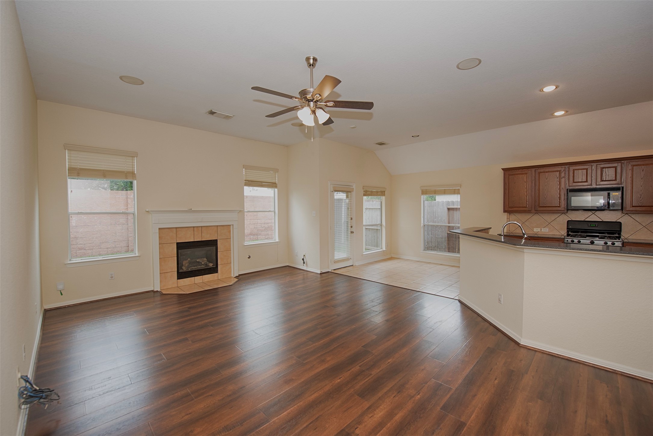 A view of the family room open to the kitchen and dining area. Wonderful floor plan for those who love to entertain.