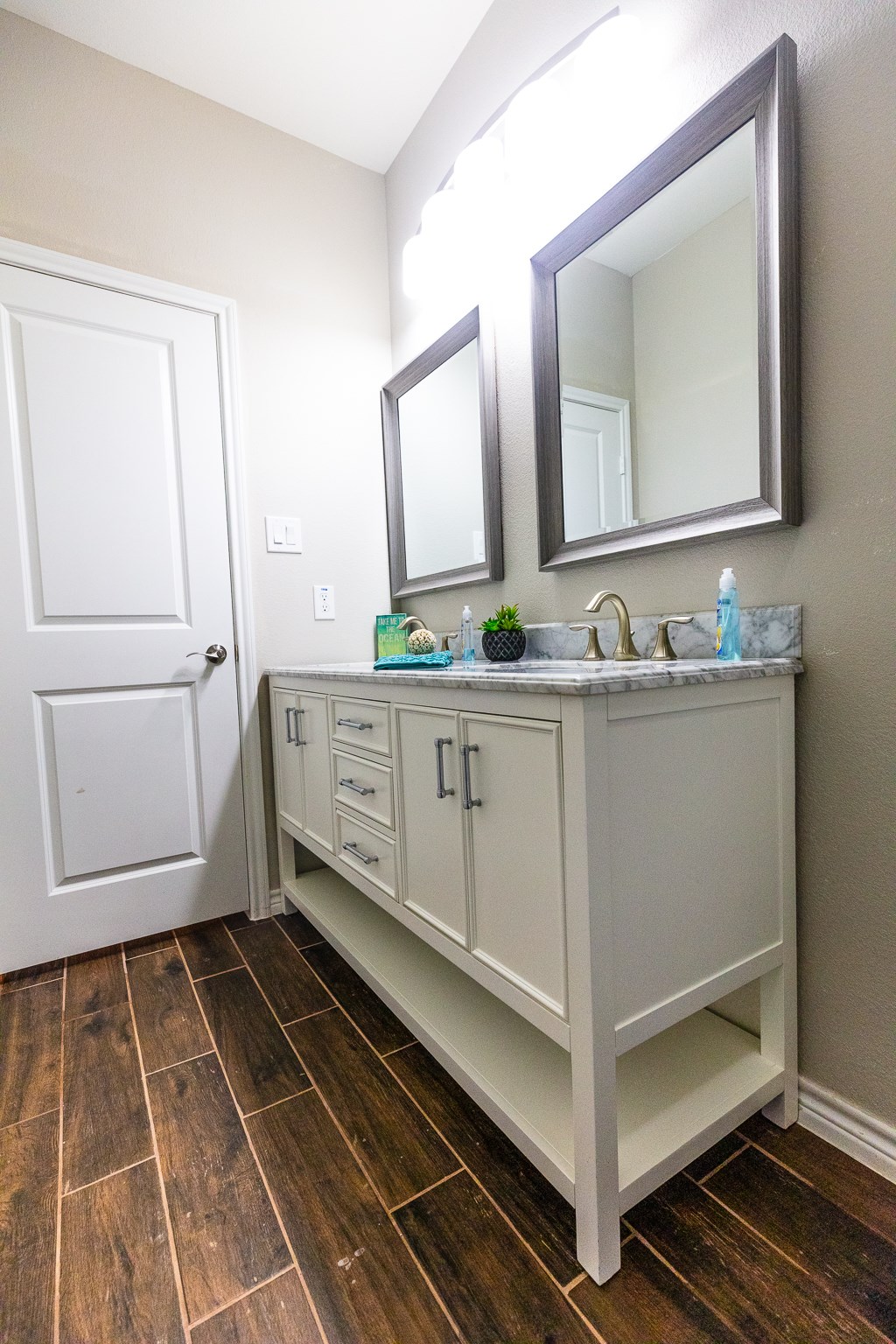 Soft closing double vanity with marble counter tops and upgraded fixtures.