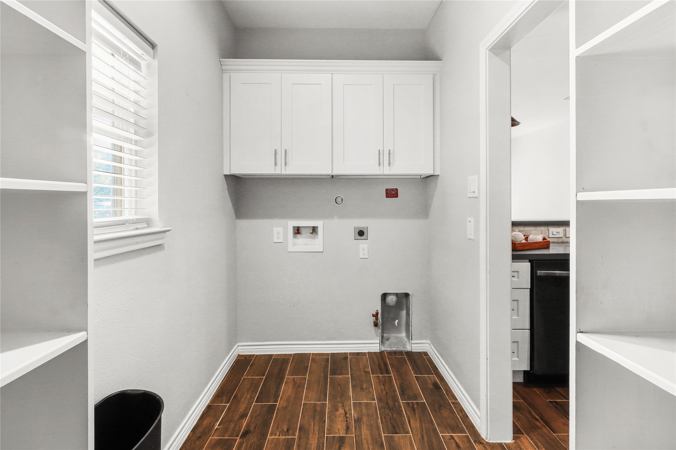 Second part of Pantry/ Utility room. Dryer can be gas or electric. Soft close cabinets above washer and dryer for more storage.