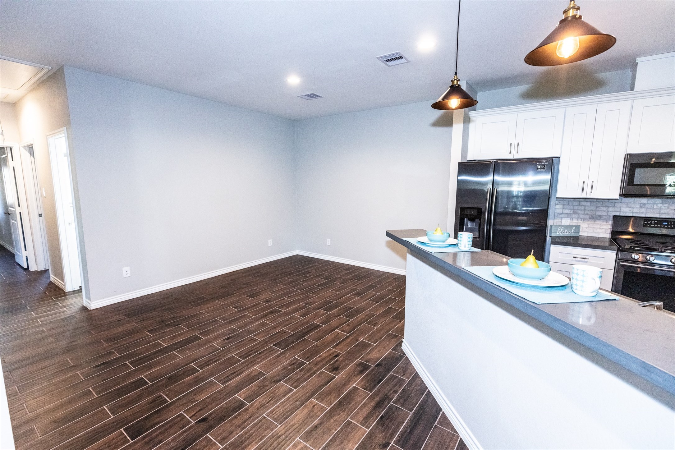Kitchen opens to dining room and living room.