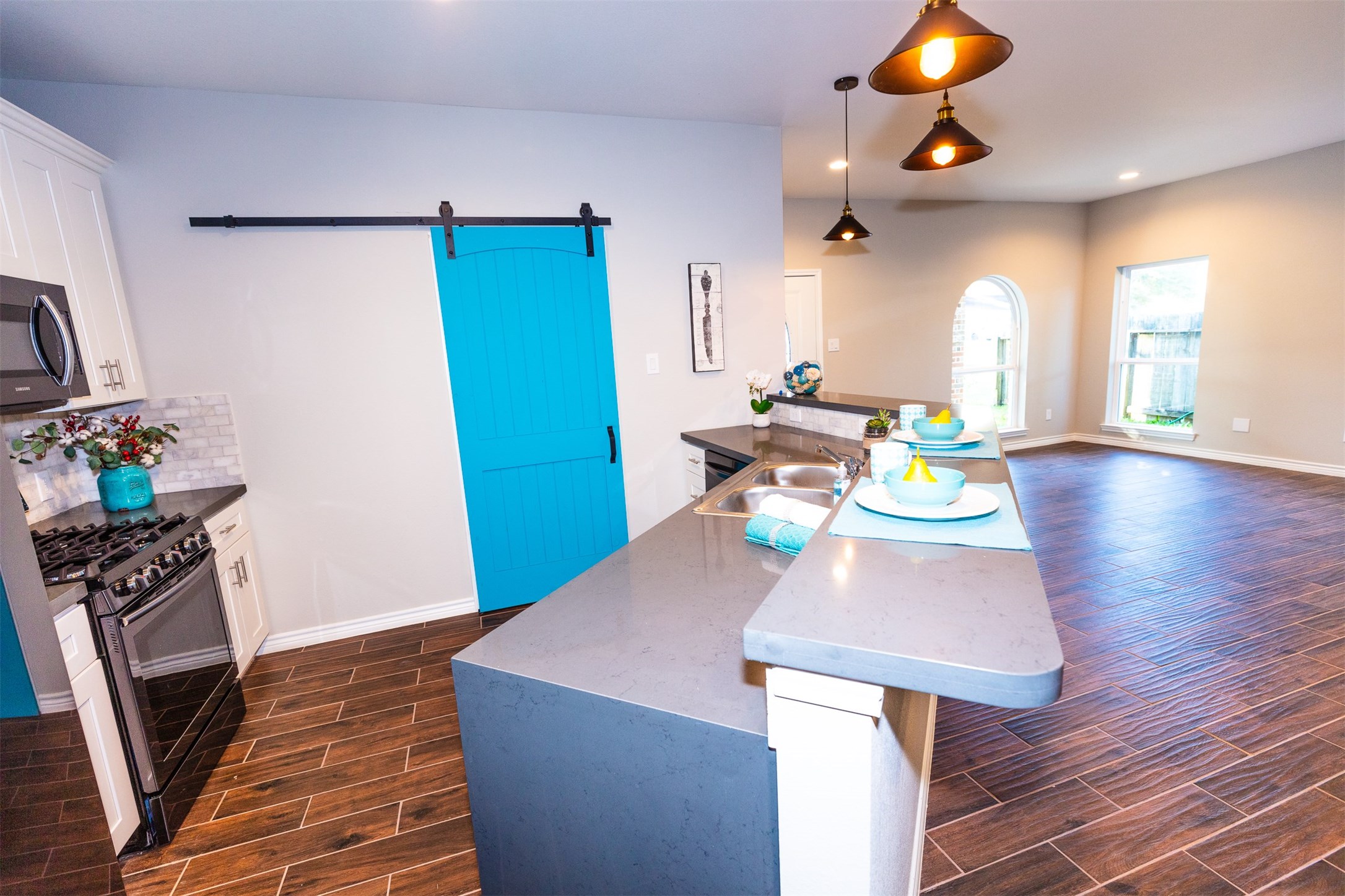 Marble backsplash and Waterfall countertops